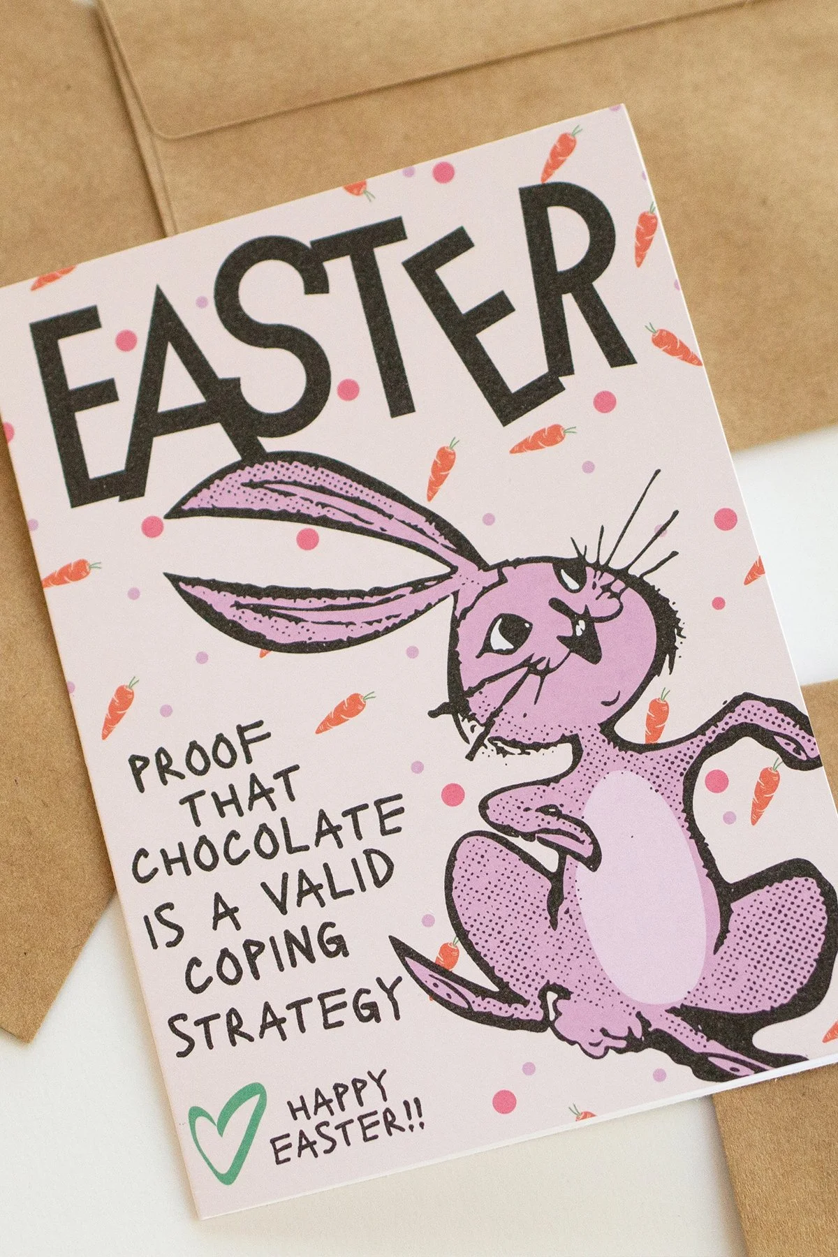 Funny 'Easter is Proof' card with illustrated easter bunny, carrots and polka dots, "Proof that chocolate is a valid coping strategy."
