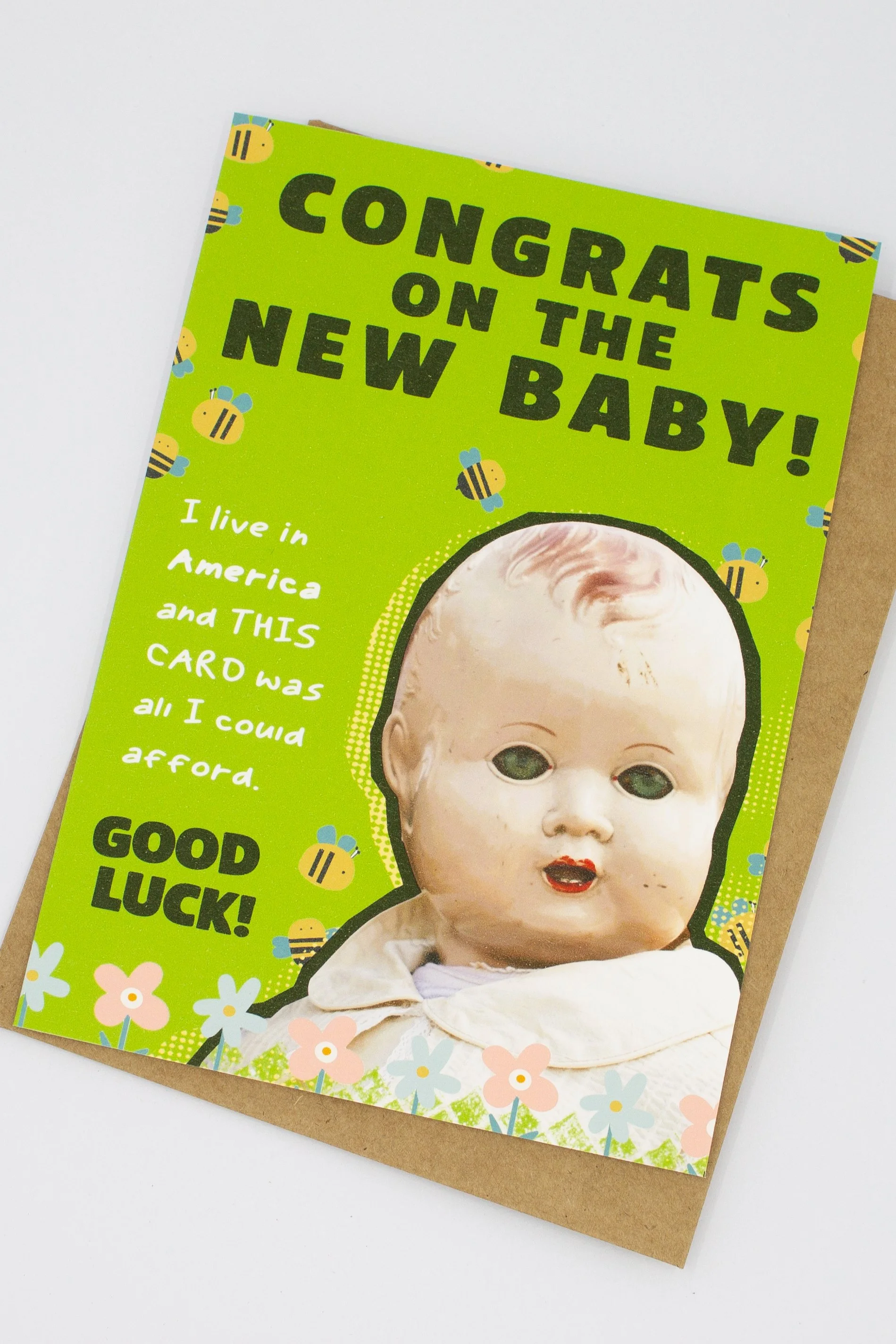 unique baby shower card featuring a delightfully creepy vintage baby doll