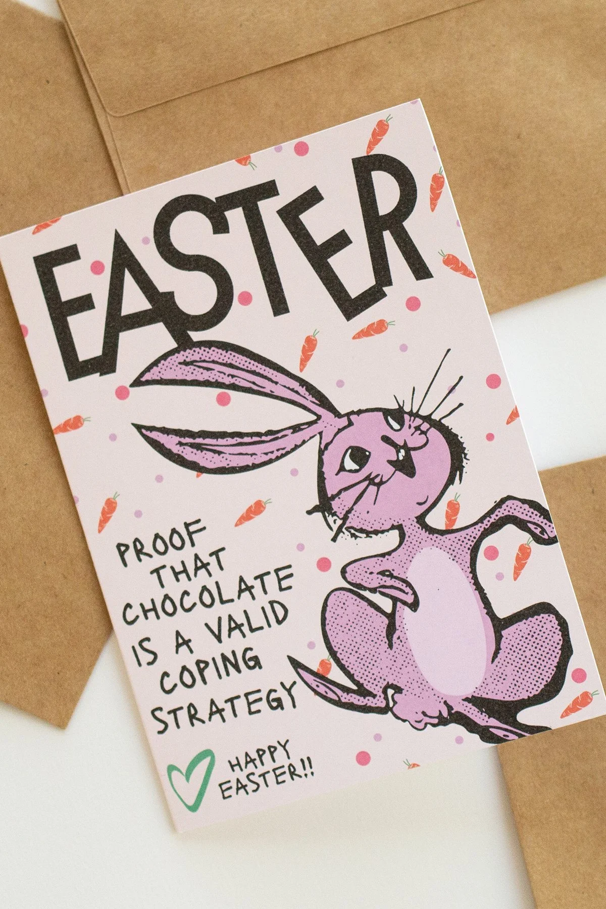 Funny 'Easter is Proof' card with illustrated easter bunny, carrots and polka dots, "Proof that chocolate is a valid coping strategy."