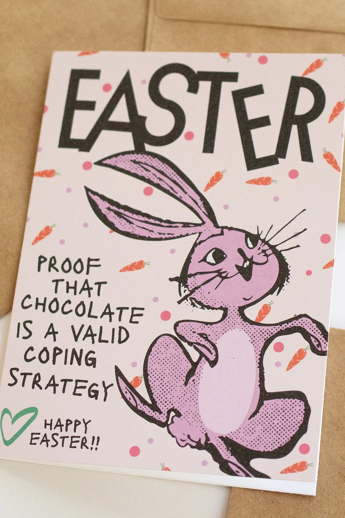 Funny 'Easter is Proof' card with illustrated easter bunny, carrots and polka dots, "Proof that chocolate is a valid coping strategy."