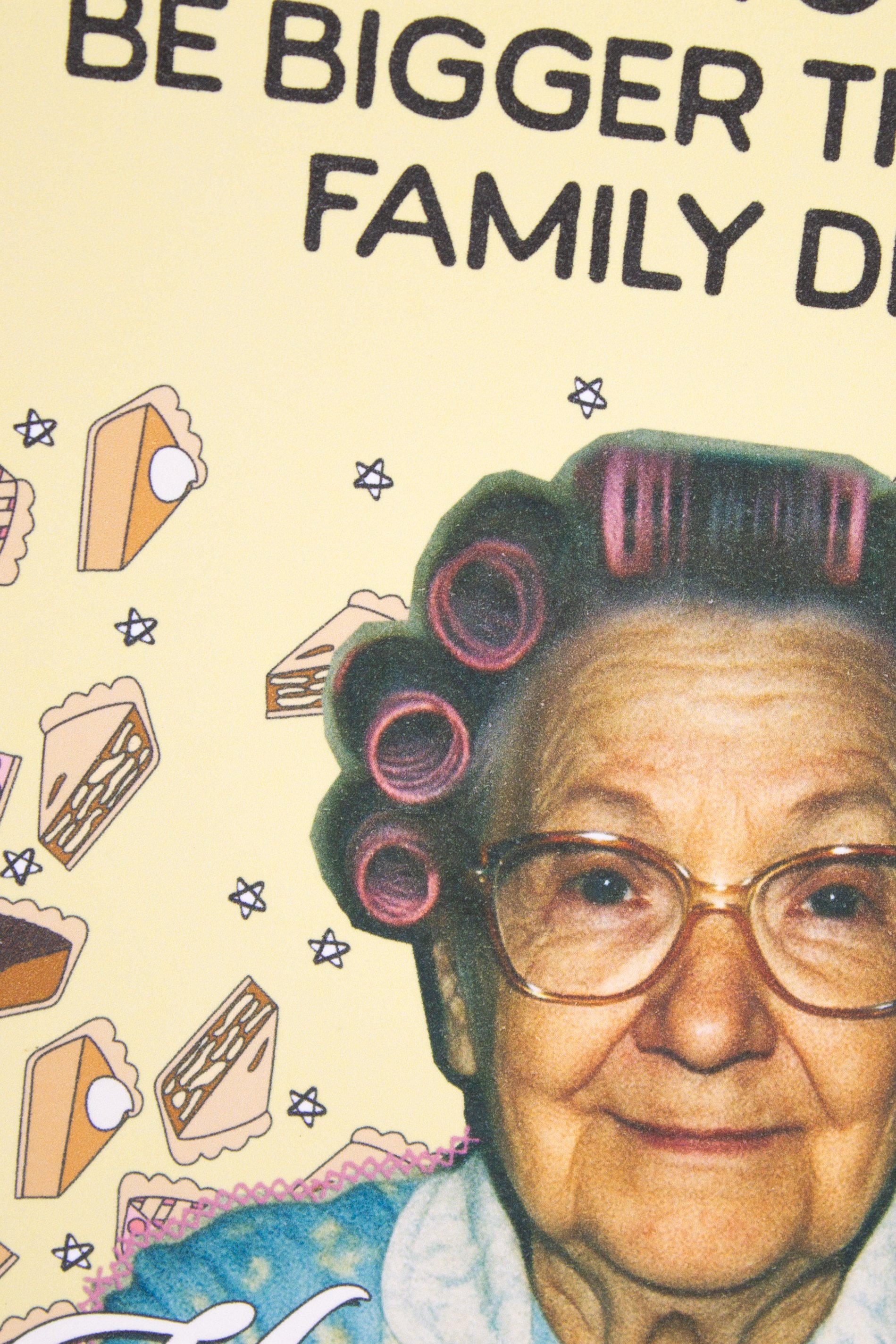 This funny Thanksgiving greeting card features a sweet vintage grandma proudly presenting a homemade pie with the delightfully optimistic wish: "May your pie be bigger than your family drama."