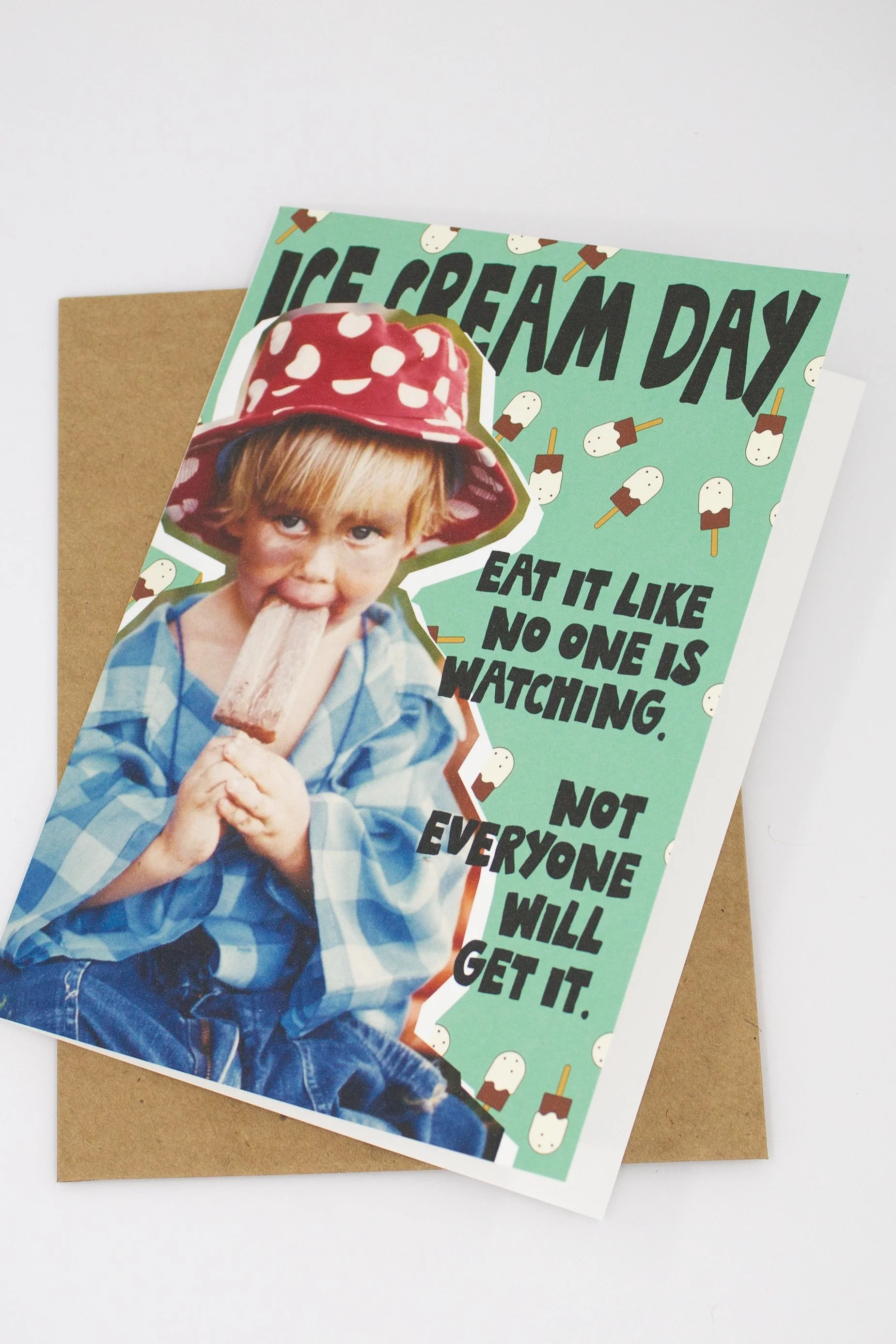 Humorous and silly National Ice Cream Day card with light colored pistachio background and ice cream popsicles.