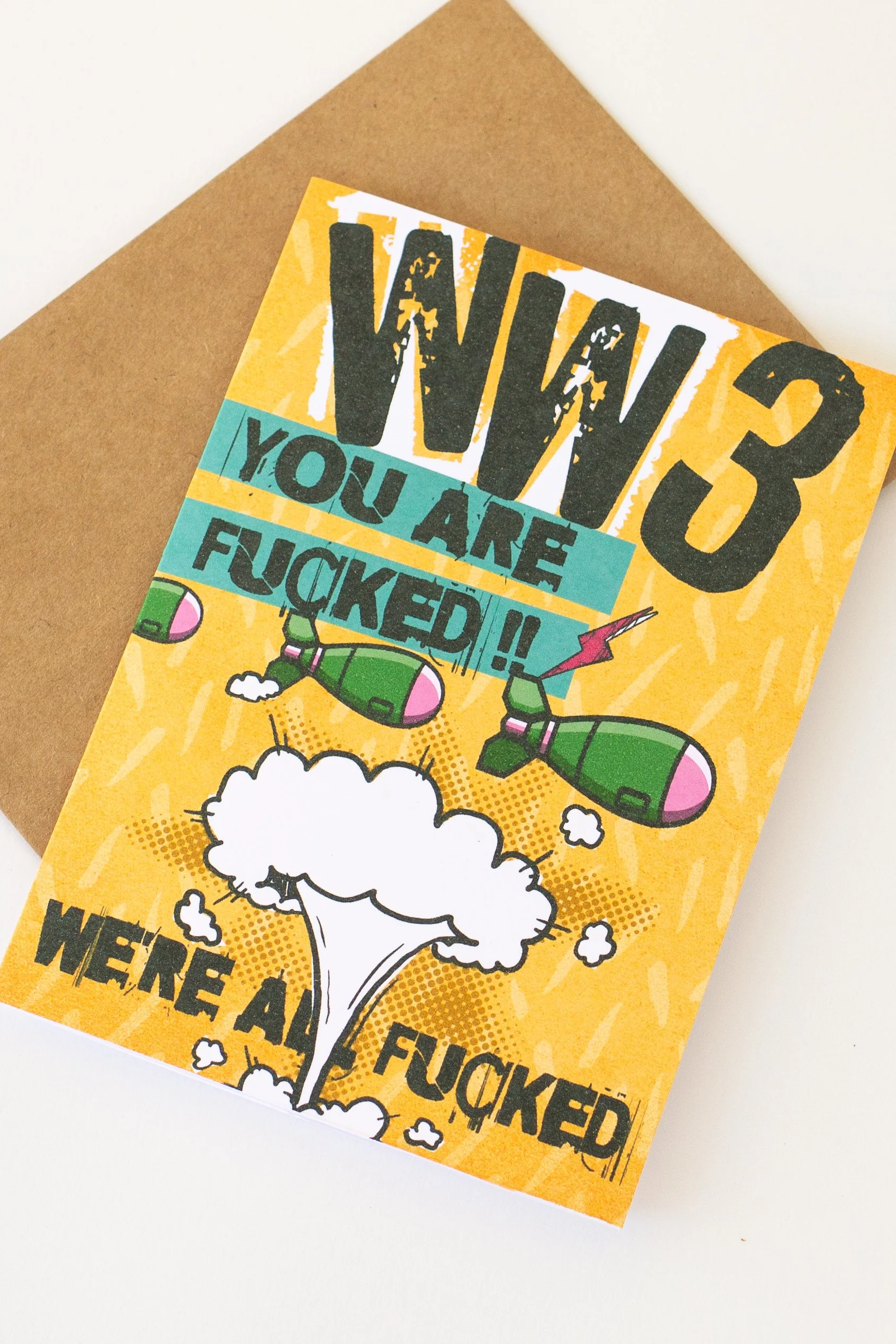 This comic-style bombs & mushroom cloud humor card is available wholesale - perfect for when life feels apocalyptic.
