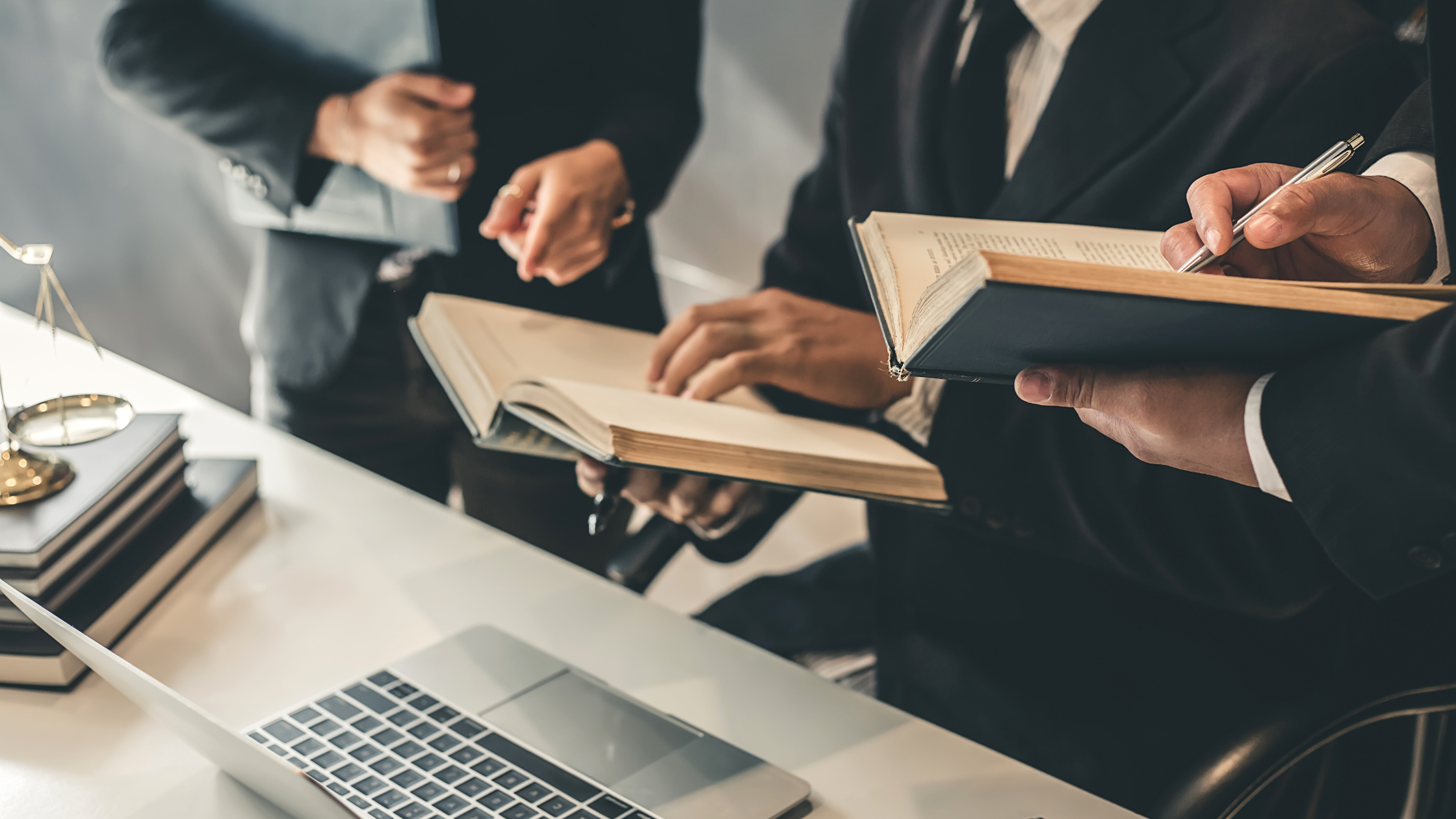 A WMMT lawyer working at their desk