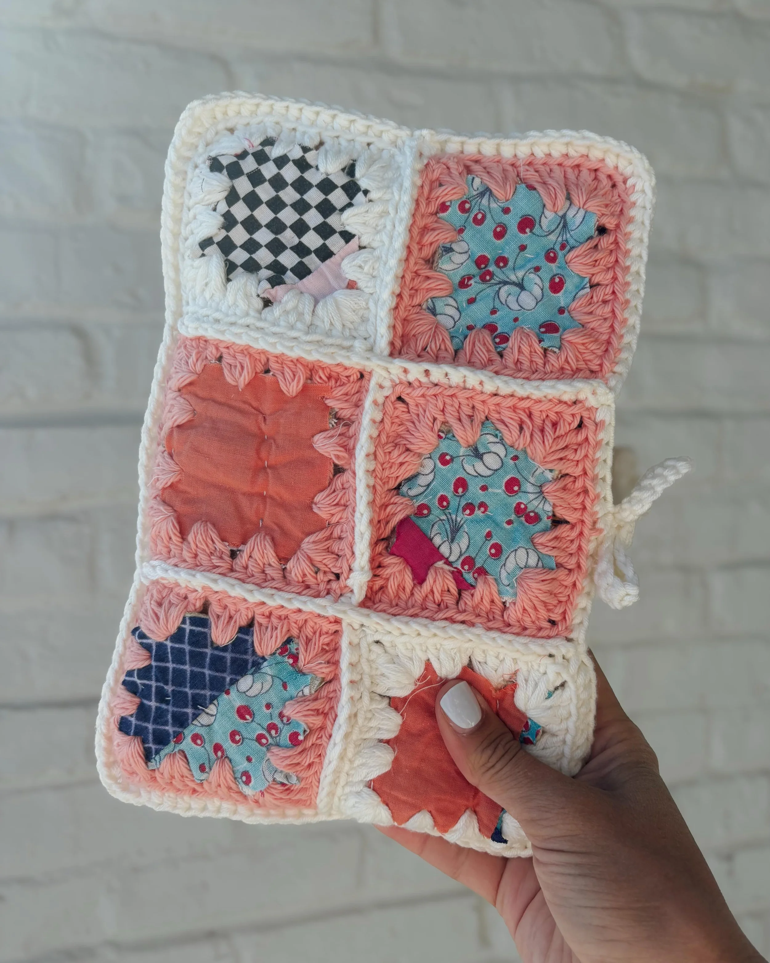 This book sleeve, made from vintage quilt scraps and cotton yarn, was crafted as a gift for a special mental health initiative hosted by @cozycrawleycorner 
Tucked inside is a copy of The Measure by @nikkierlick 🧶

If you&rsquo;ve read it, you know 