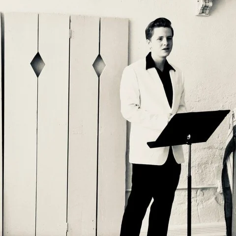 teenage boy performing at Dr. Ada Hunter's music studio recital performance