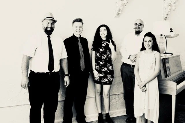 students posing after their singing recital