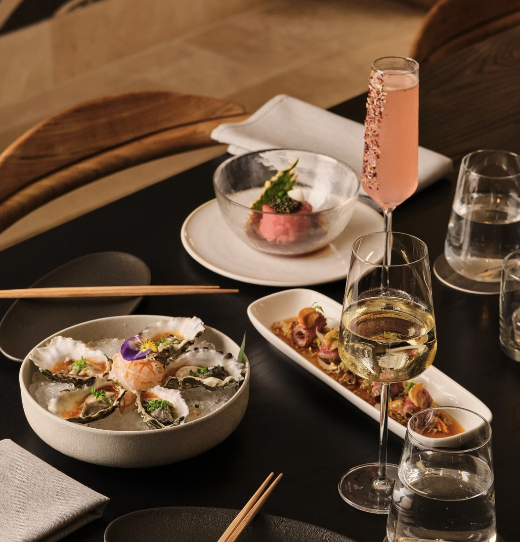 Assorted plated dishes arranged on a restaurant table.