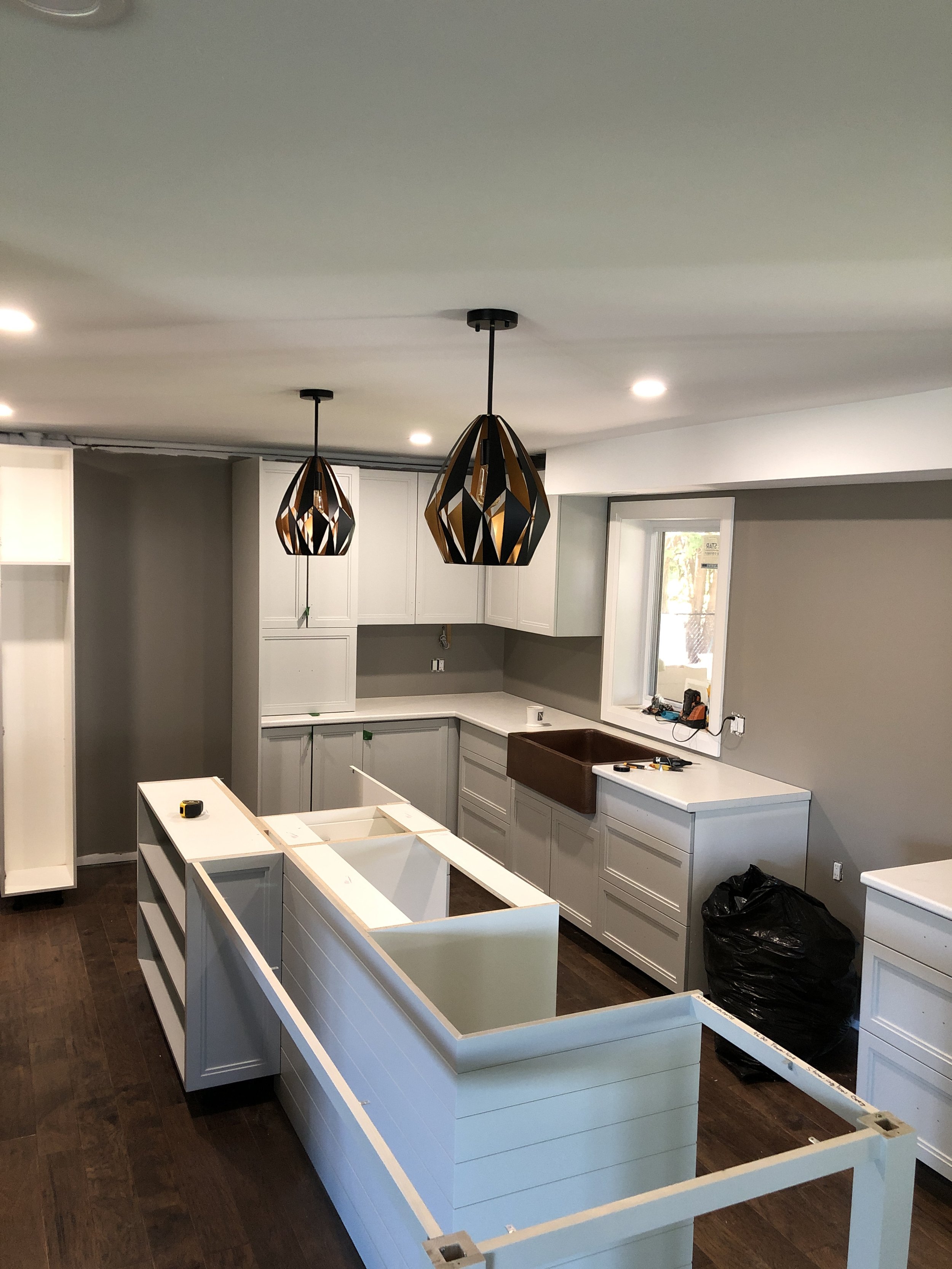 Cabinetry installation in-progress (subcontracted).