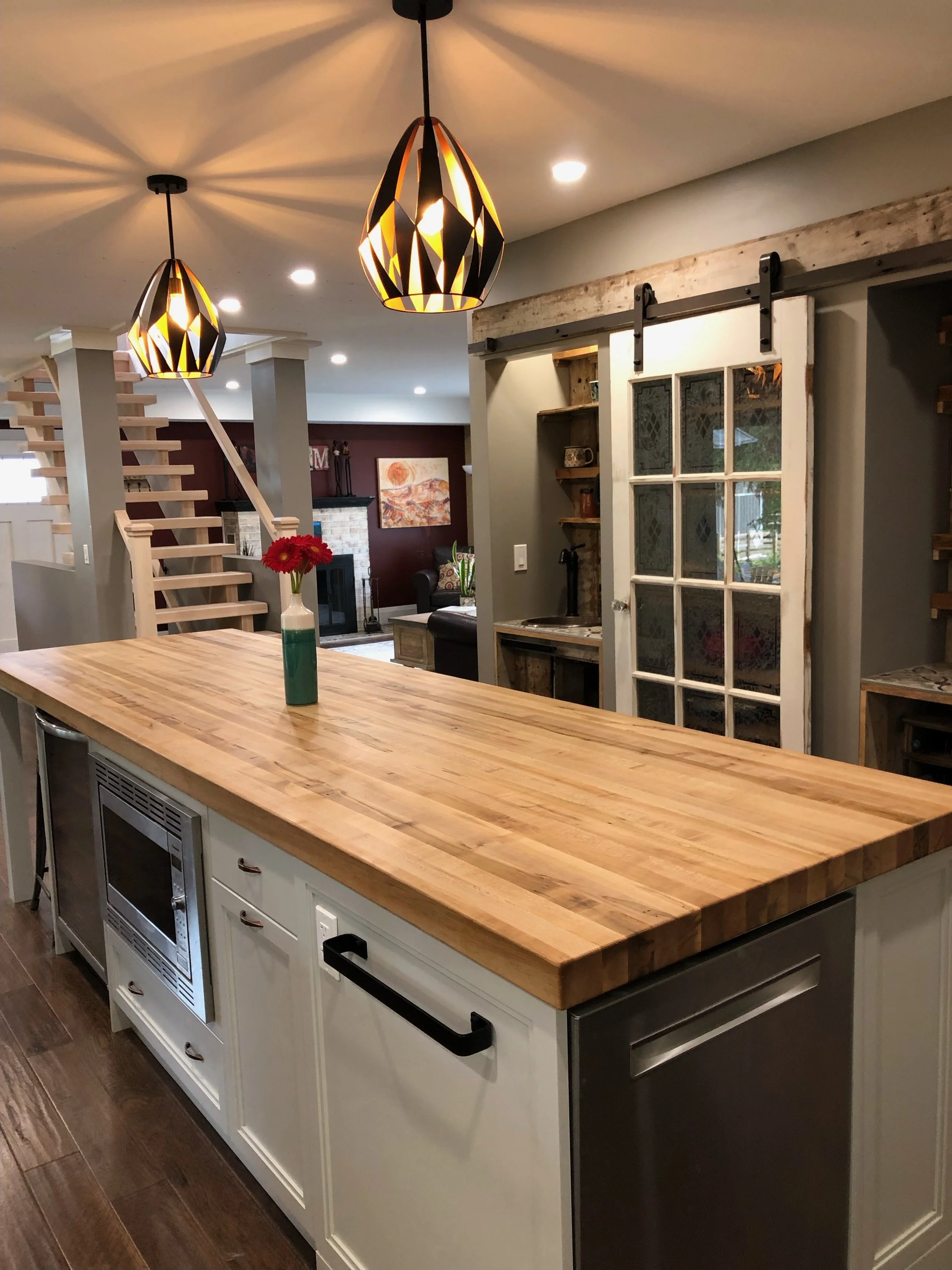 Finished island with custom wormy maple butcher block top.