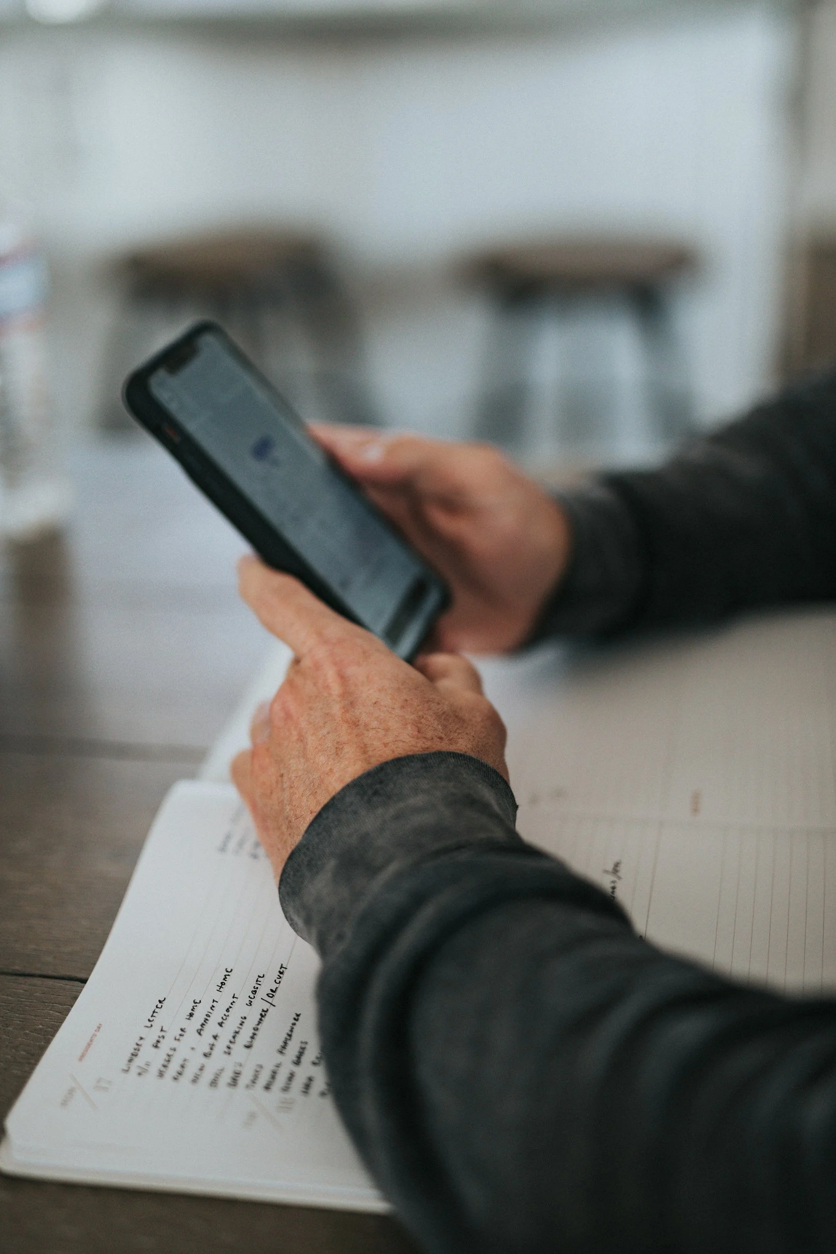 Hands of a user reading a blog post on their phone
