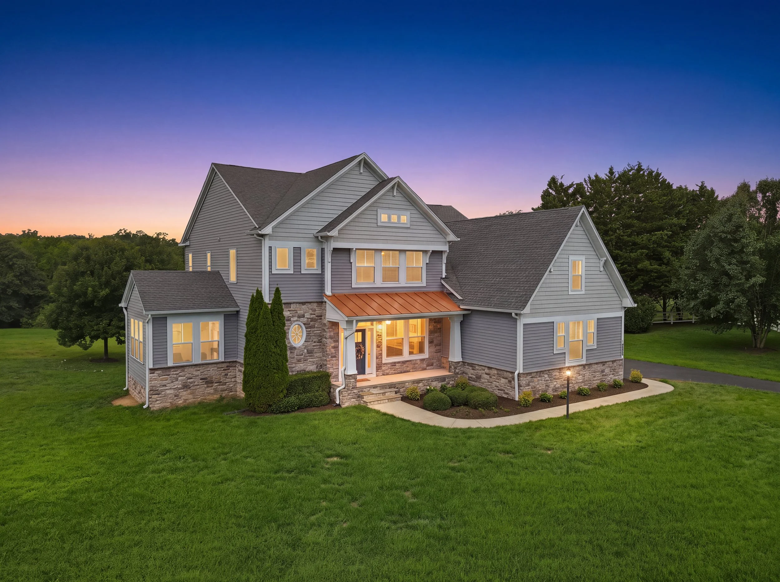 Real estate listing photo of a home exterior at twilight Fredericksburg, VA