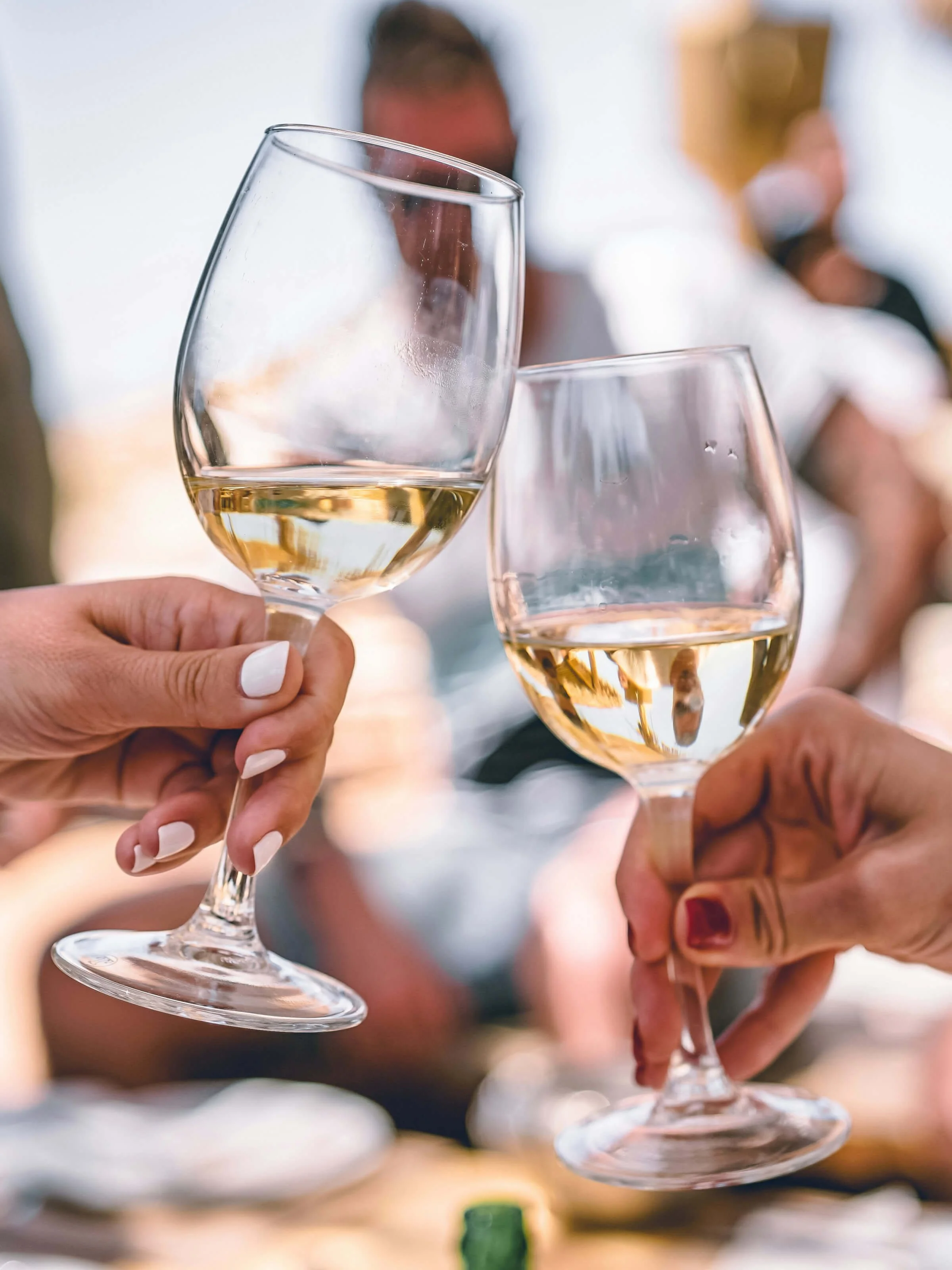 women-toasting-with-white-wine.jpg