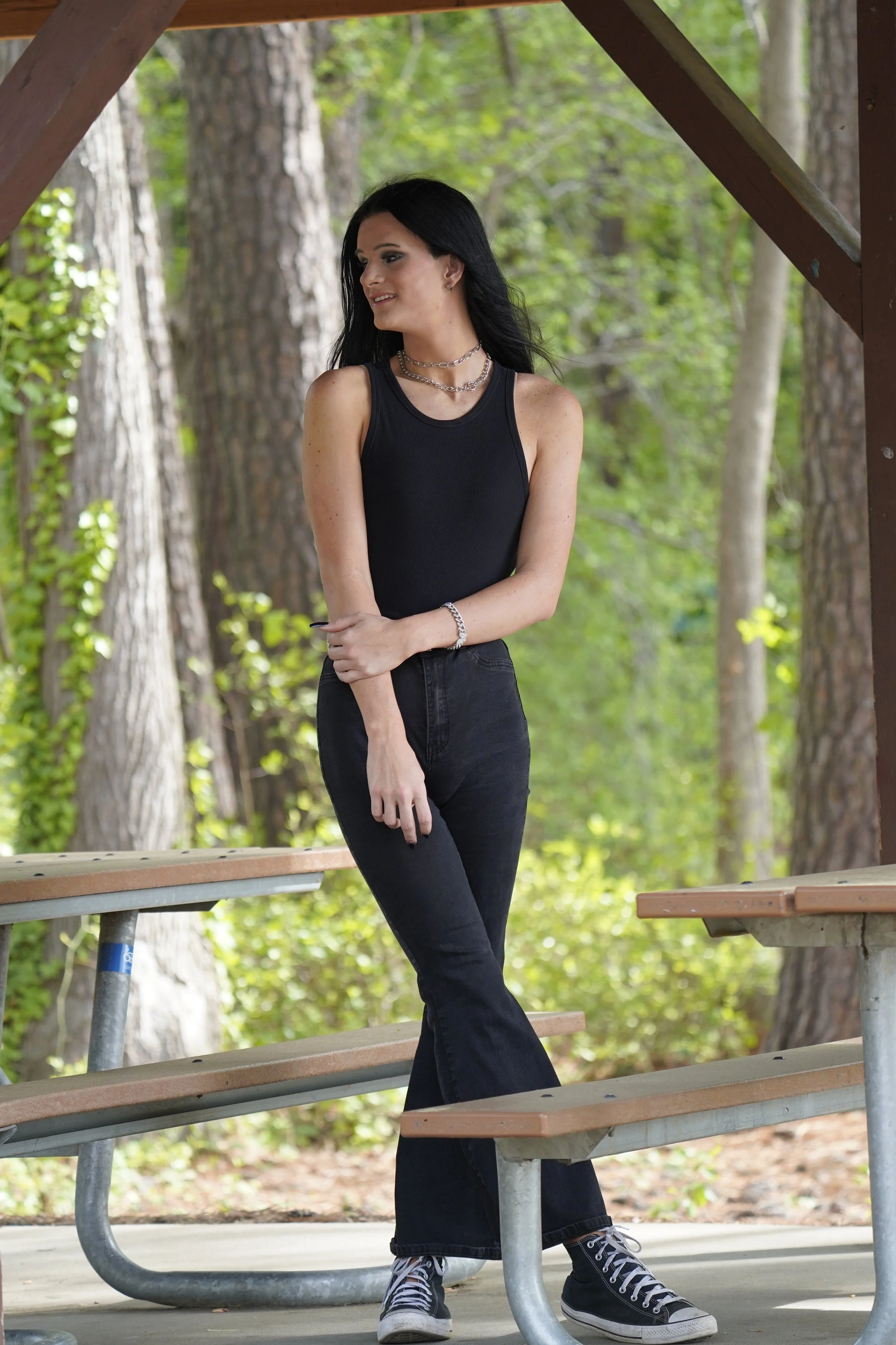 A woman poses at Lake Crabtree for her senior photos, Raleigh, North Carolina. High School Senior Photography.