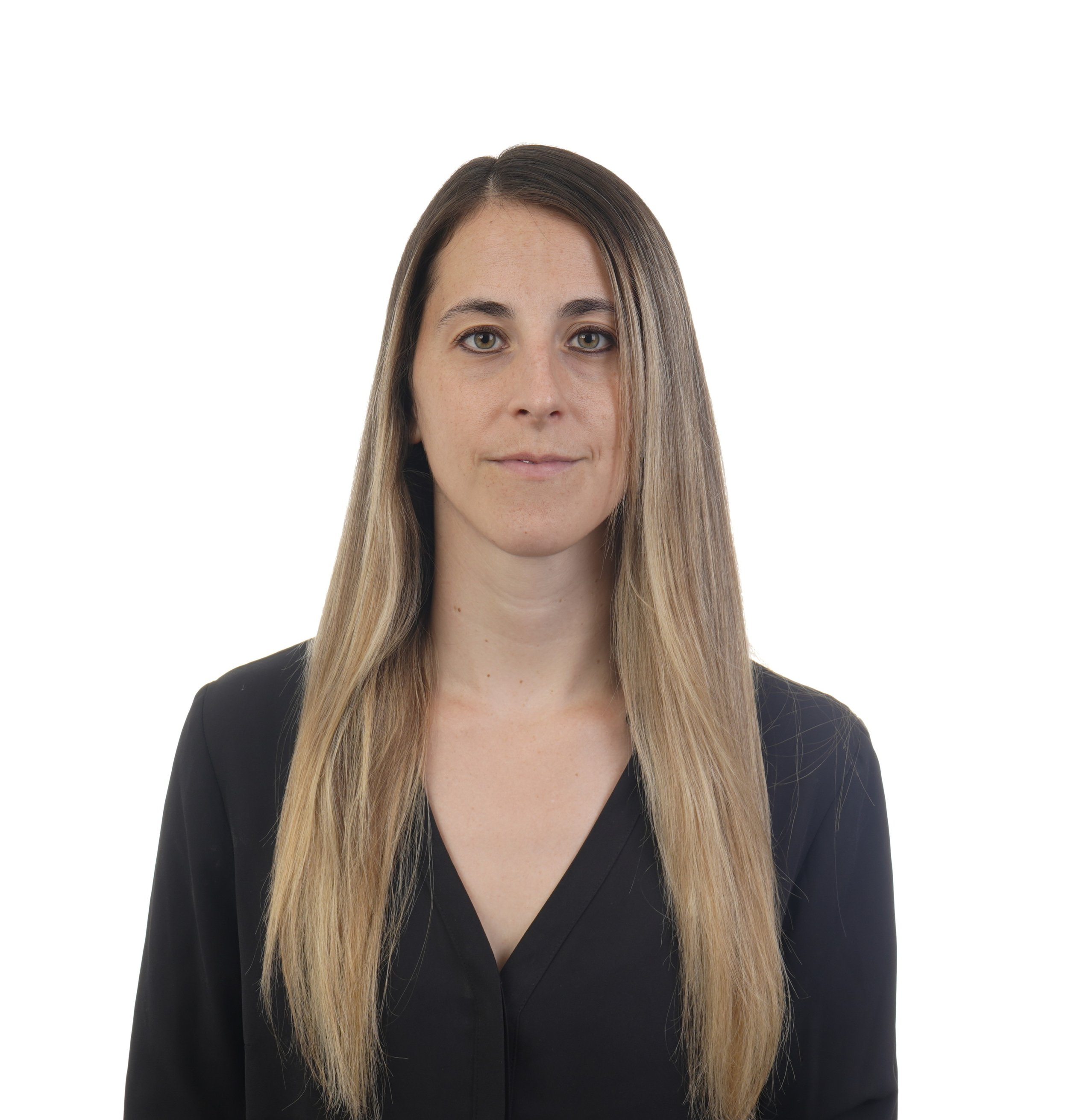 A U.S. Passport photo example of a blonde woman against a white background looking at the camera with a neutral expression