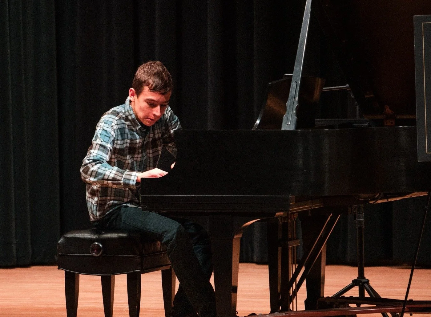 Advanced piano student performing at a Grace's Piano Studio recital in Fort Wayne
