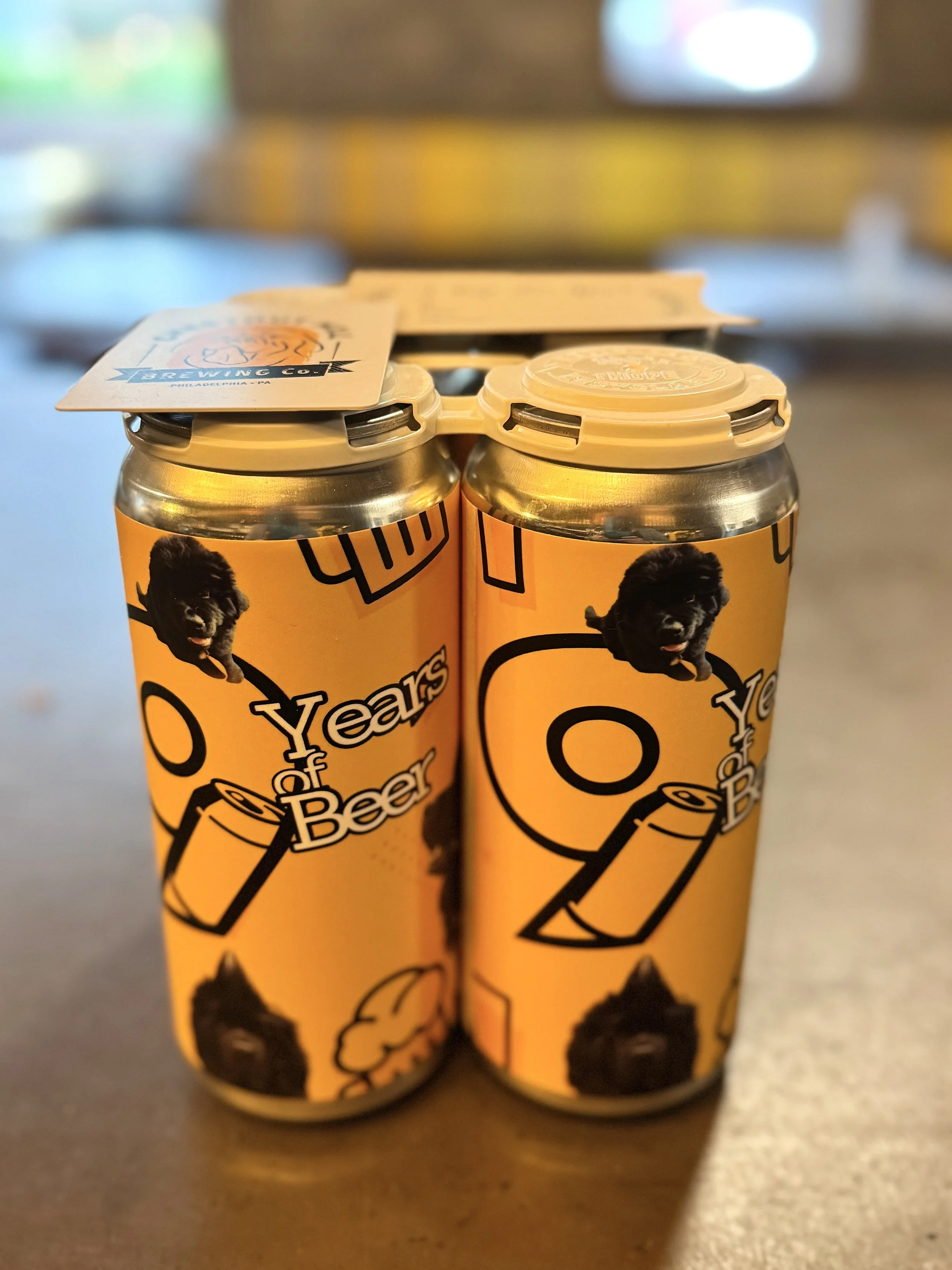 9 Years of Beer four-pack of cans designed for Chestnut Hill Brewing Company featuring the three newfoundland dog mascots of the brewery.