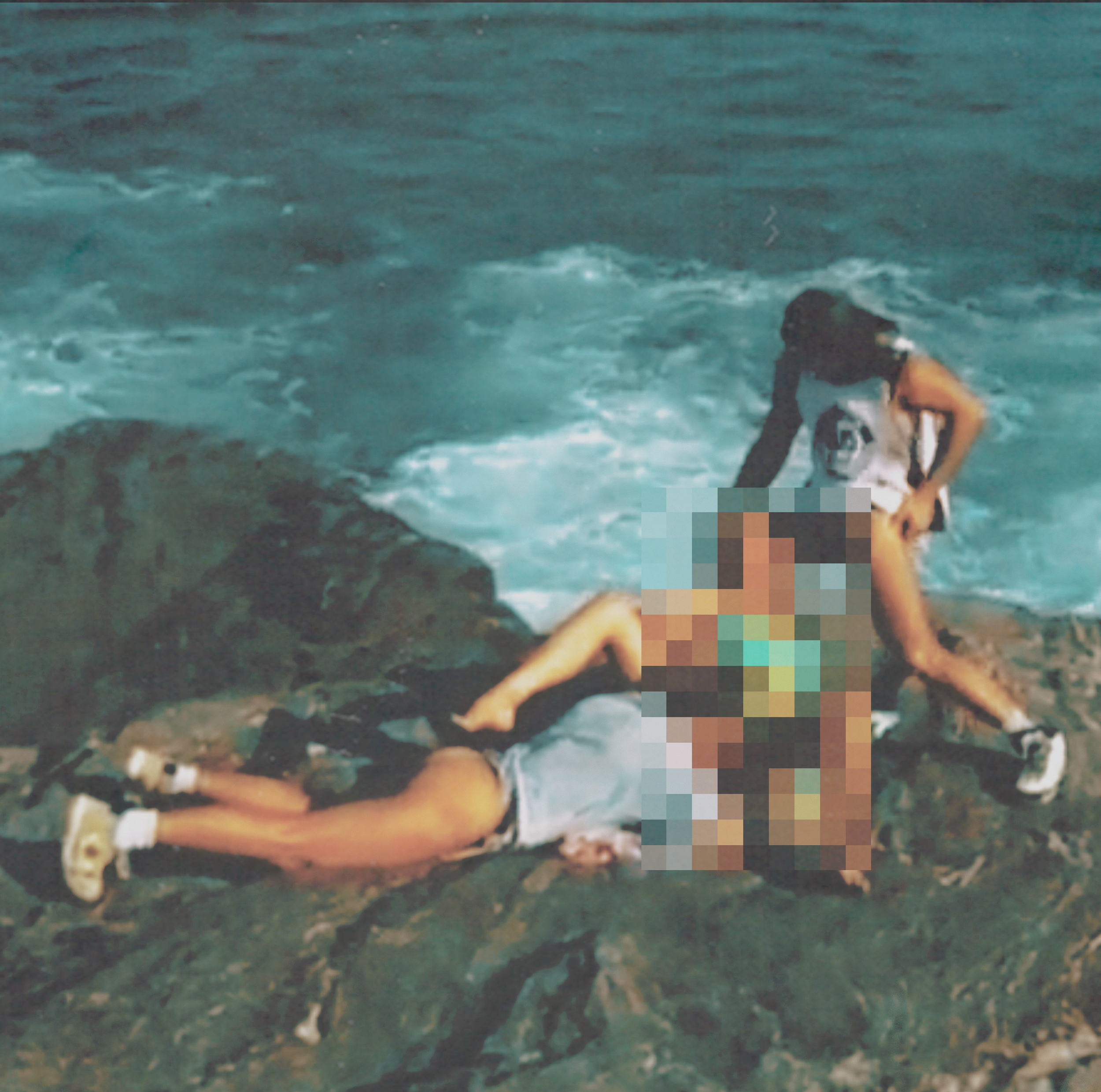 Two children are on a rocky shoreline at night, with the ocean and waves in the background. One child is lying face down on the rocks, and the other is crouching next to an obscured, pixelated figure.