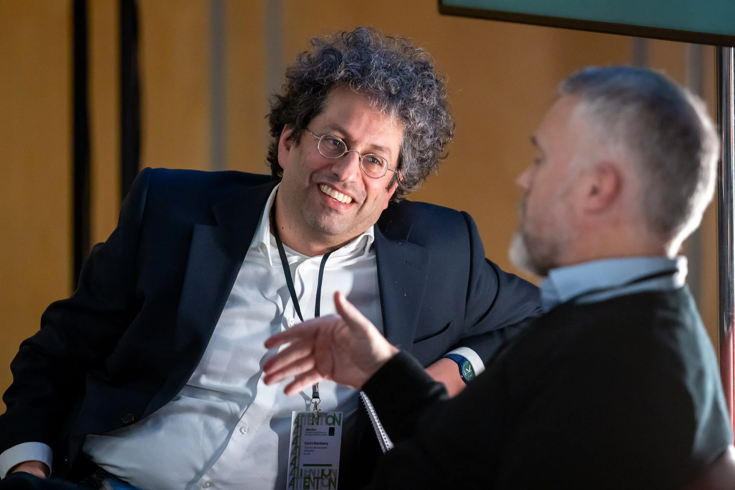 Karim Bardeesy, Executive Director at the Dais, listens intently to Peter Loewen