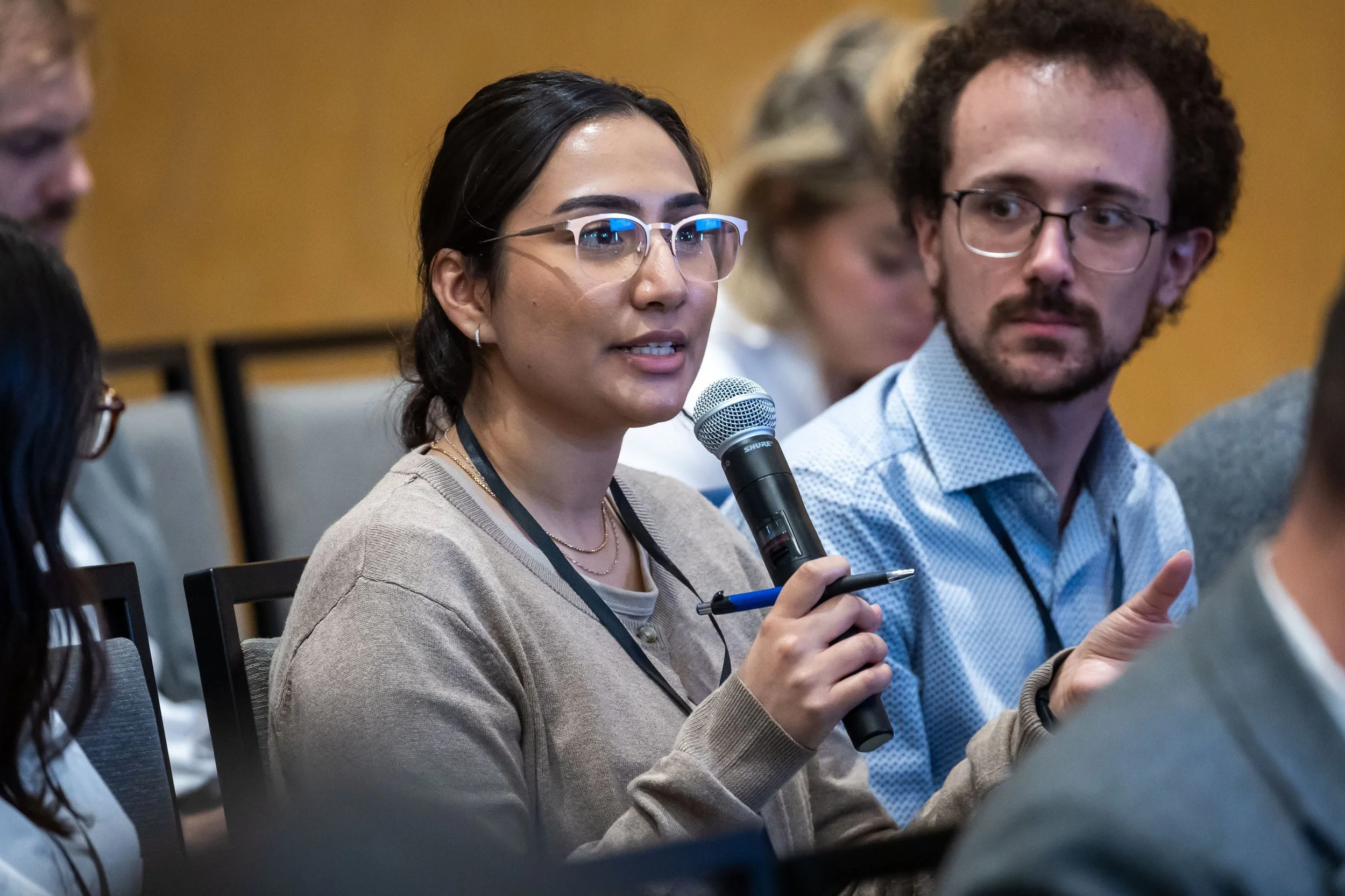 Rupinder Liddar, PhD Fellow at MEO, asks a question while Mathieu Lavigne, postdoctoral Fellow in the Program in Quantitative Social Science at Dartmouth College, listens