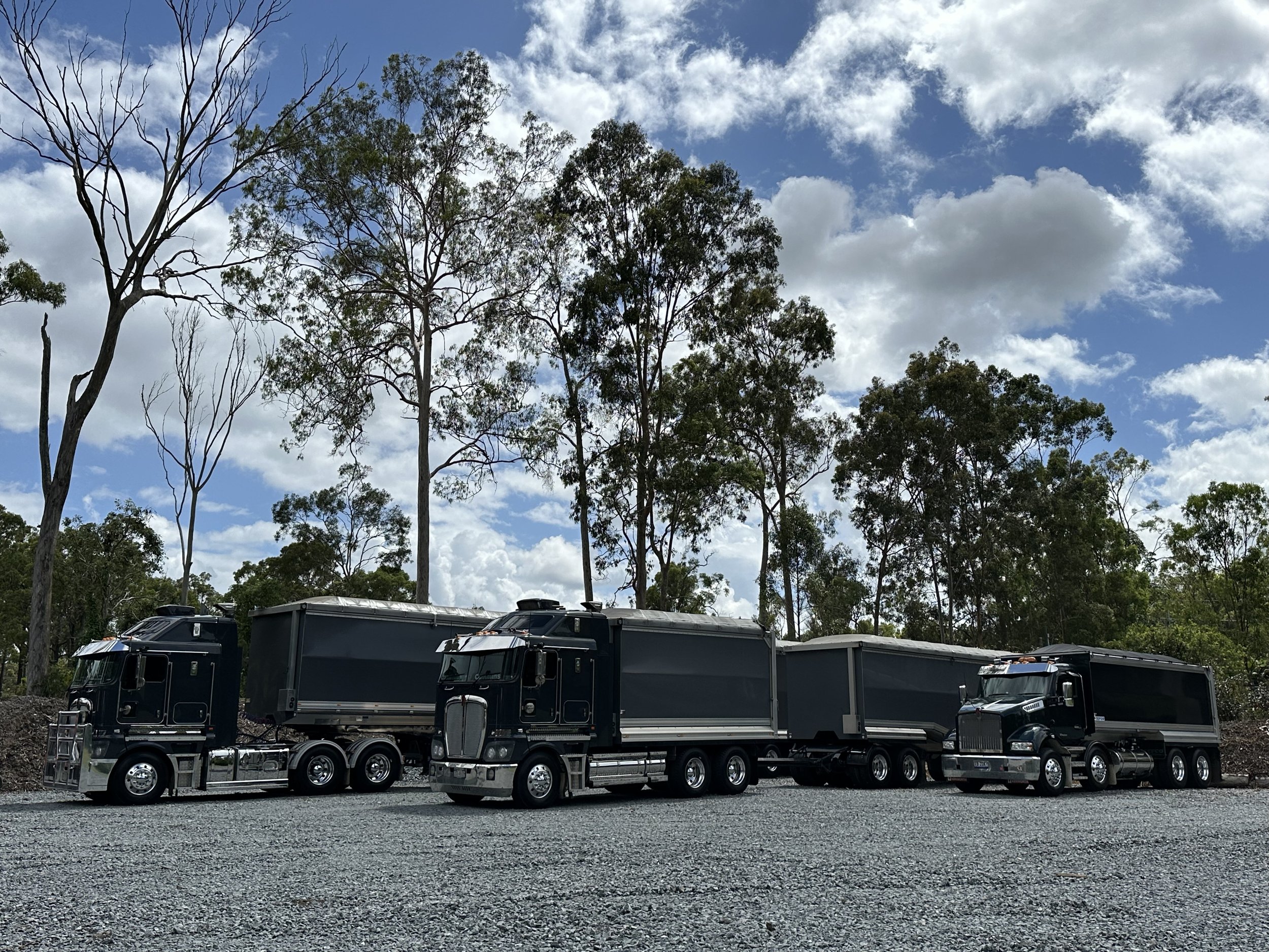 3 trucks clouds landscape.jpg