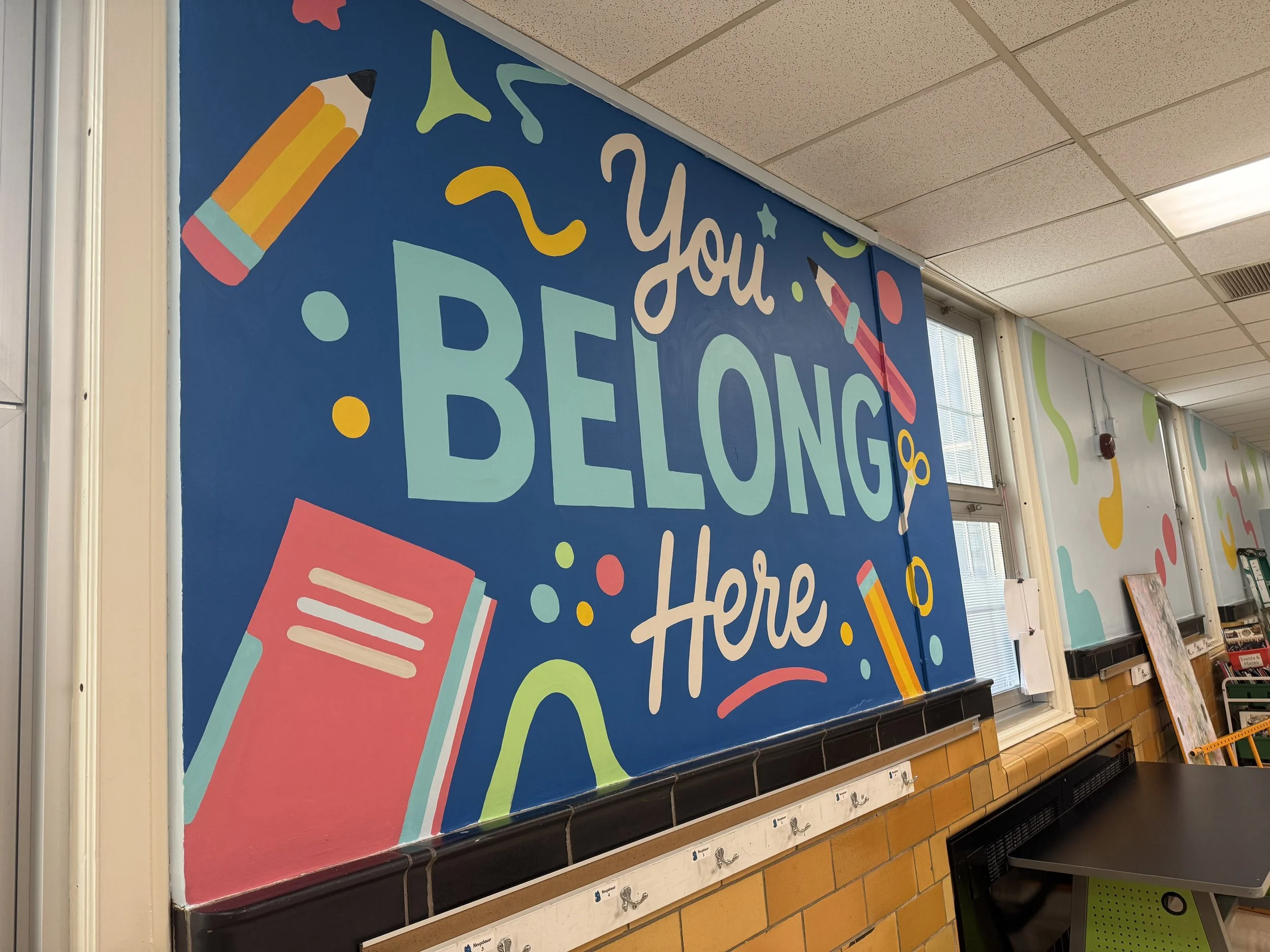 Colorful school bulletin board with the words 'You Belong Here'