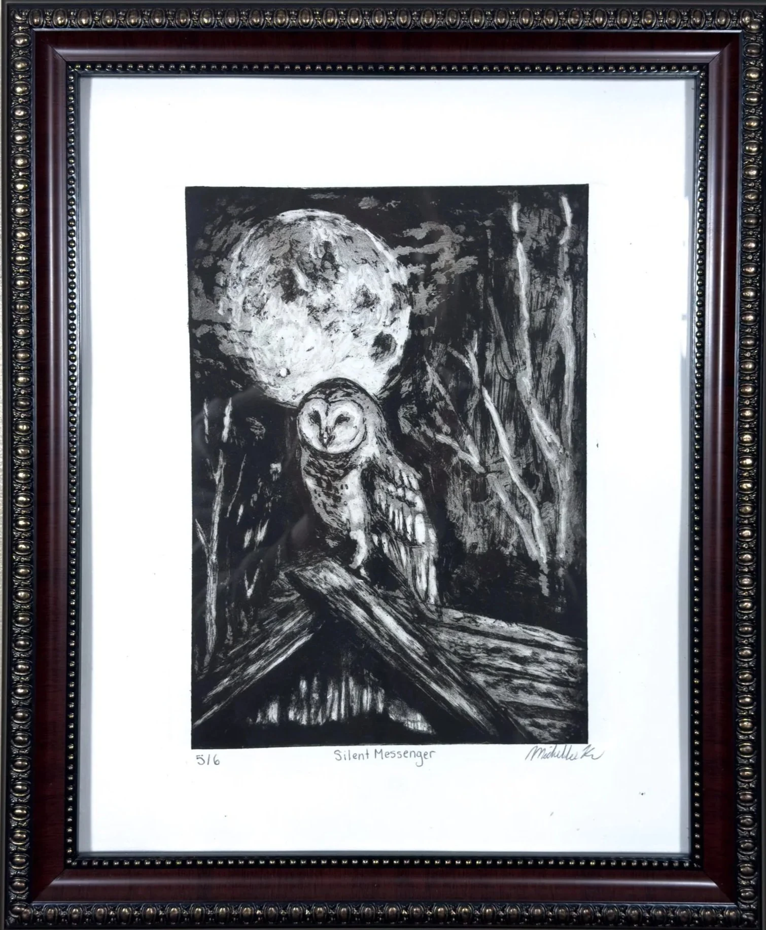 A black and white drawing titled "Silent Messenger" depicting a wise owl with a large moon in the background, surrounded by dark, textured details, framed in ornate wood with metallic accents.