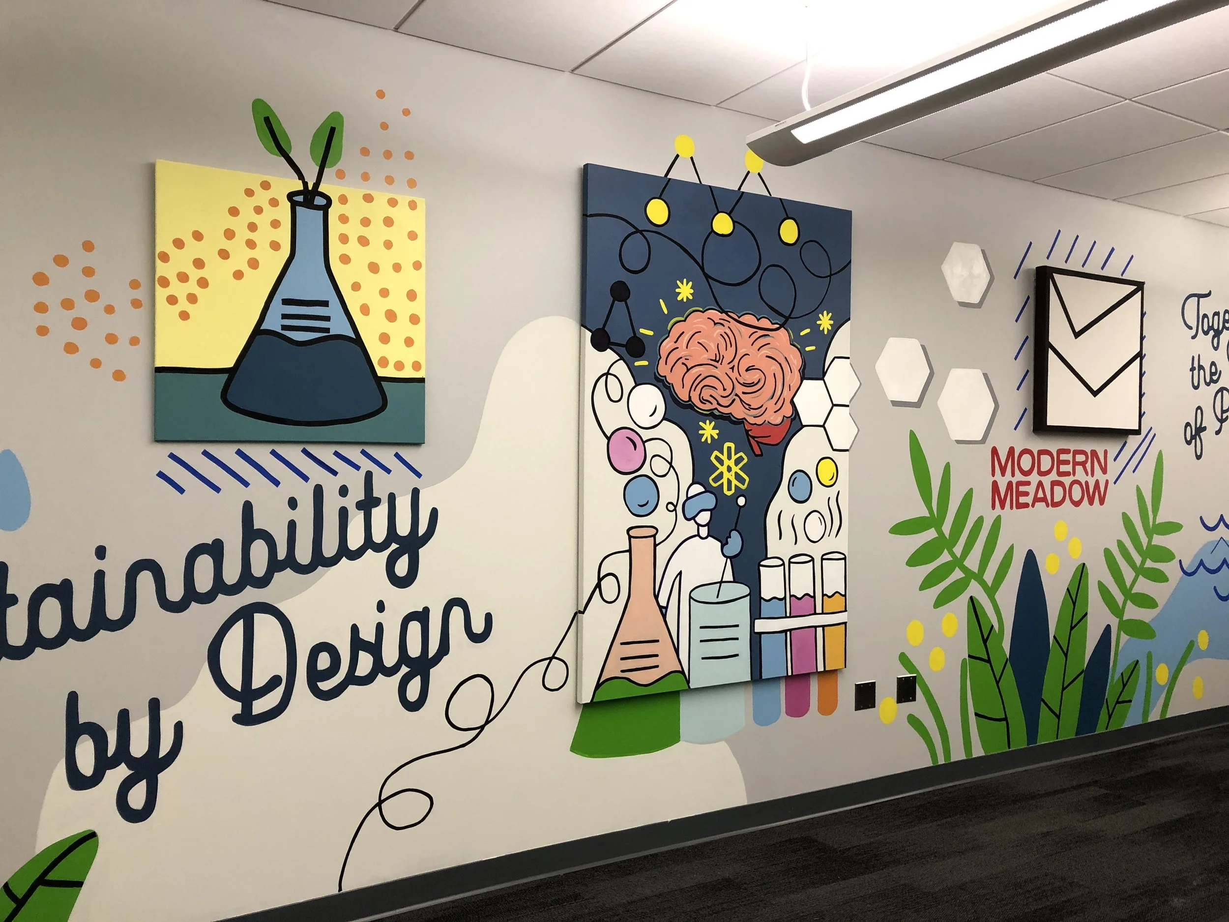 Colorful mural featuring illustrations of laboratory glassware, a brain, molecules, and text with decorative elements, promoting creativity and scientific exploration.
