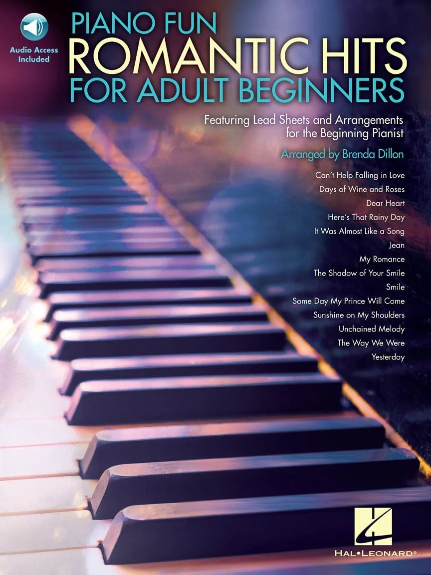 Cover of a music book titled "Piano Fun Romantic Hits for Adult Beginners", with a blurred background image of piano keys and purple and blue lighting. Includes a list of song titles and mentions audio access, arranged by Brenda Dillon, and the Hal Leonard logo.