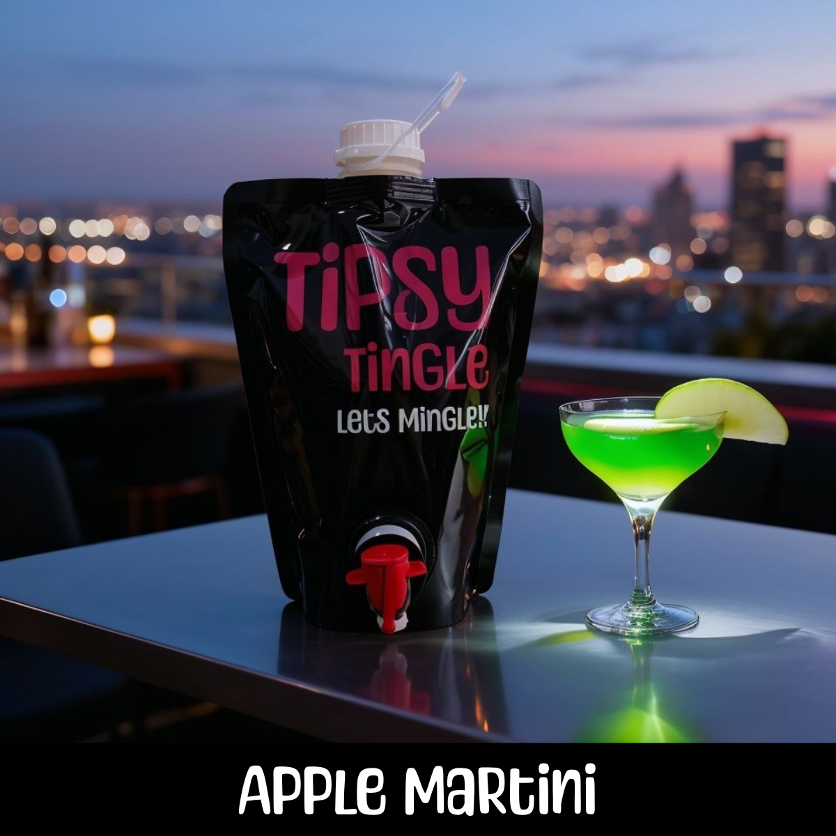 A black pouch of Taisy Tingle with colorful text and a spout, and a glass of green apple martini garnished with a slice of green apple, set on a white table with a city skyline at dusk in the background.