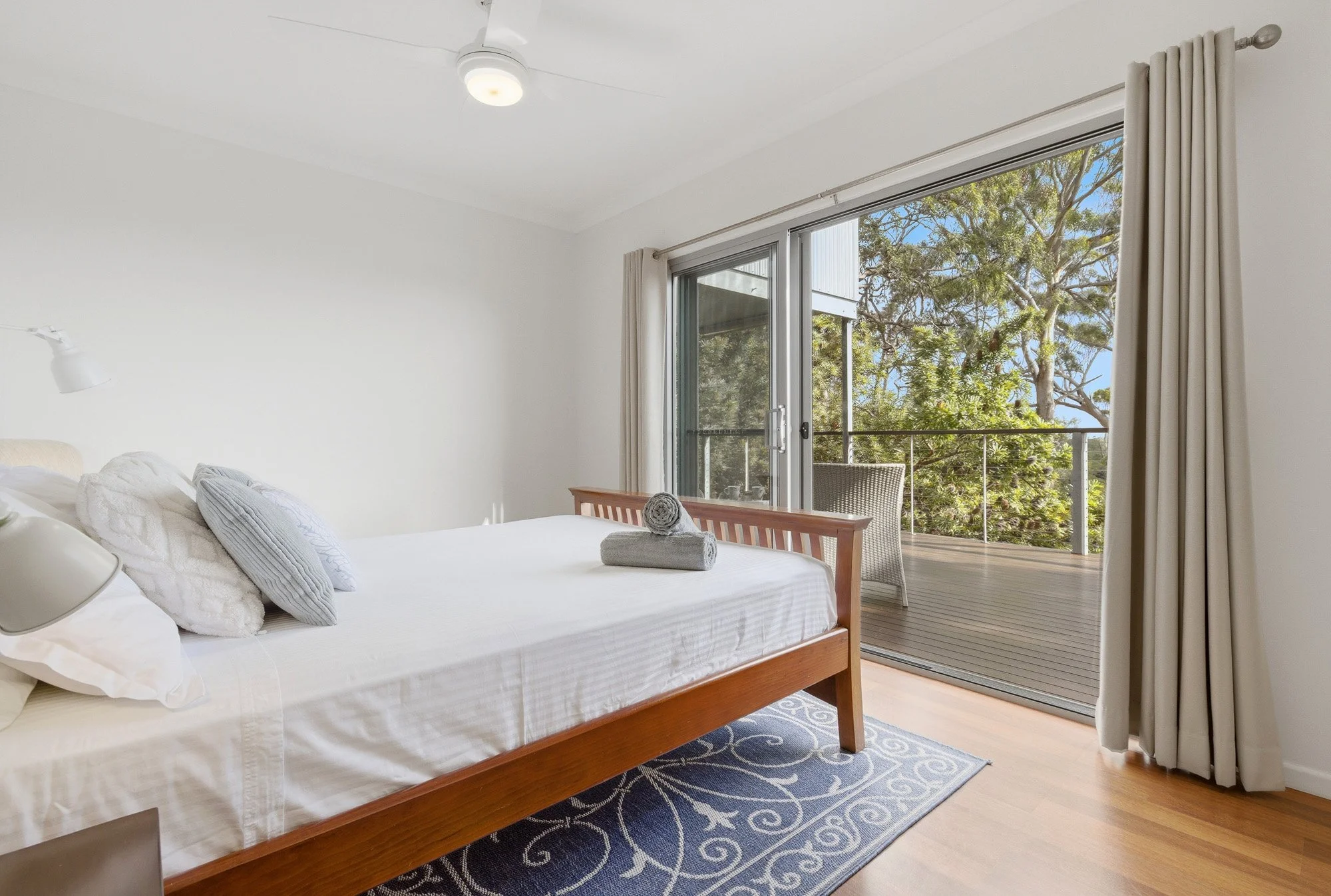 Spacious upstairs bedroom opening directly onto the deck, allowing for natural light, fresh sea breezes and a relaxed island atmosphere.