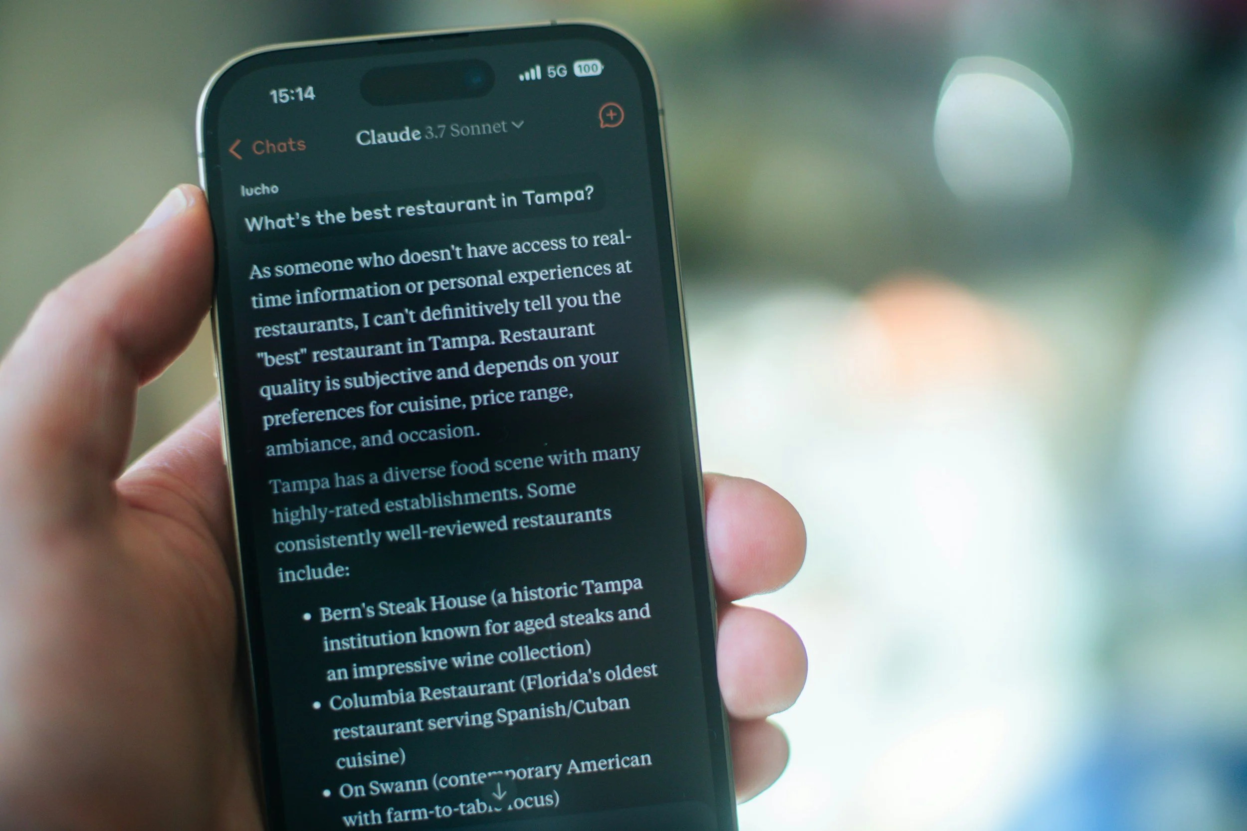 Mobile phone displaying an AI-generated search response, illustrating content optimization for AI search and Google AI Overviews.