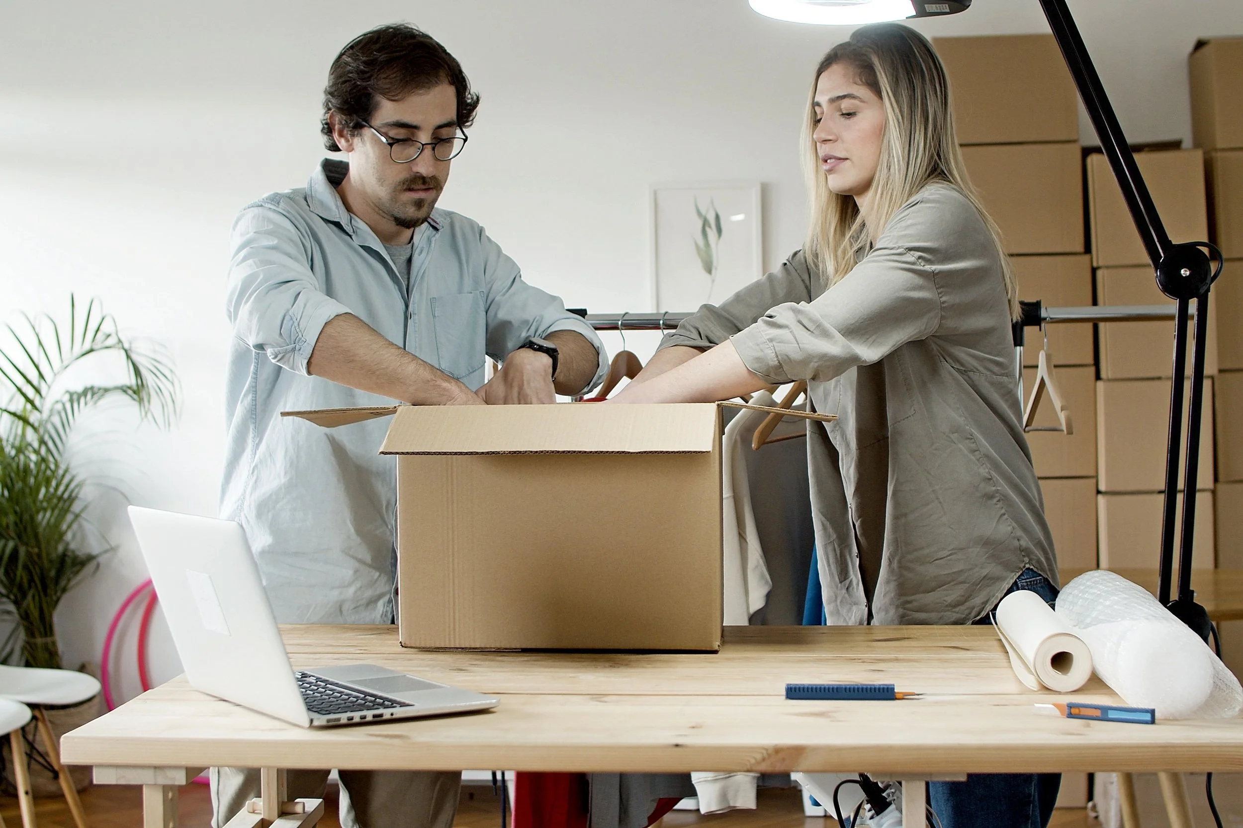 Ecommerce team preparing customer orders representing repeat purchases and long-term customer value