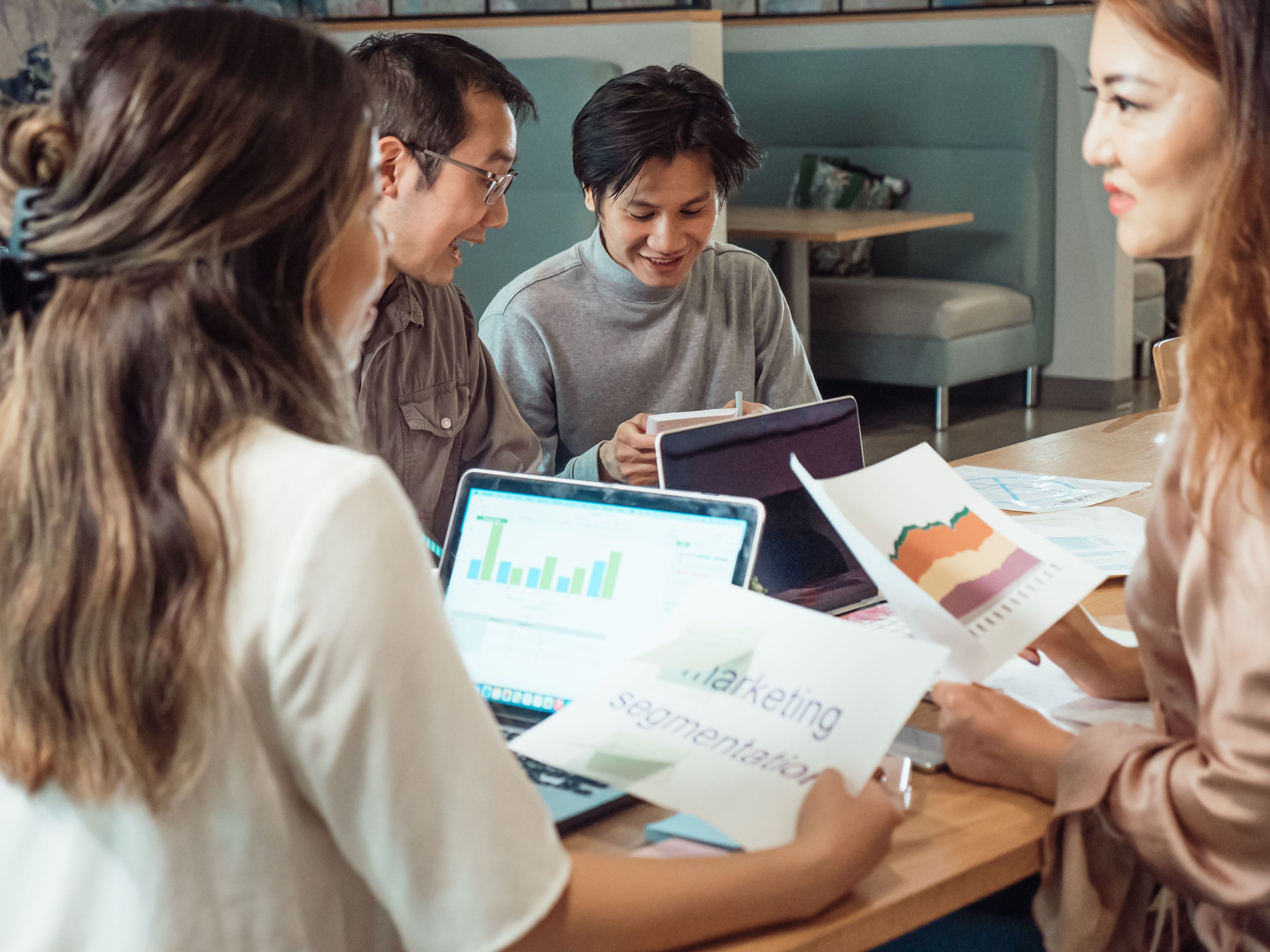 Marketing team reviewing charts and data during a marketing data governance strategy meeting