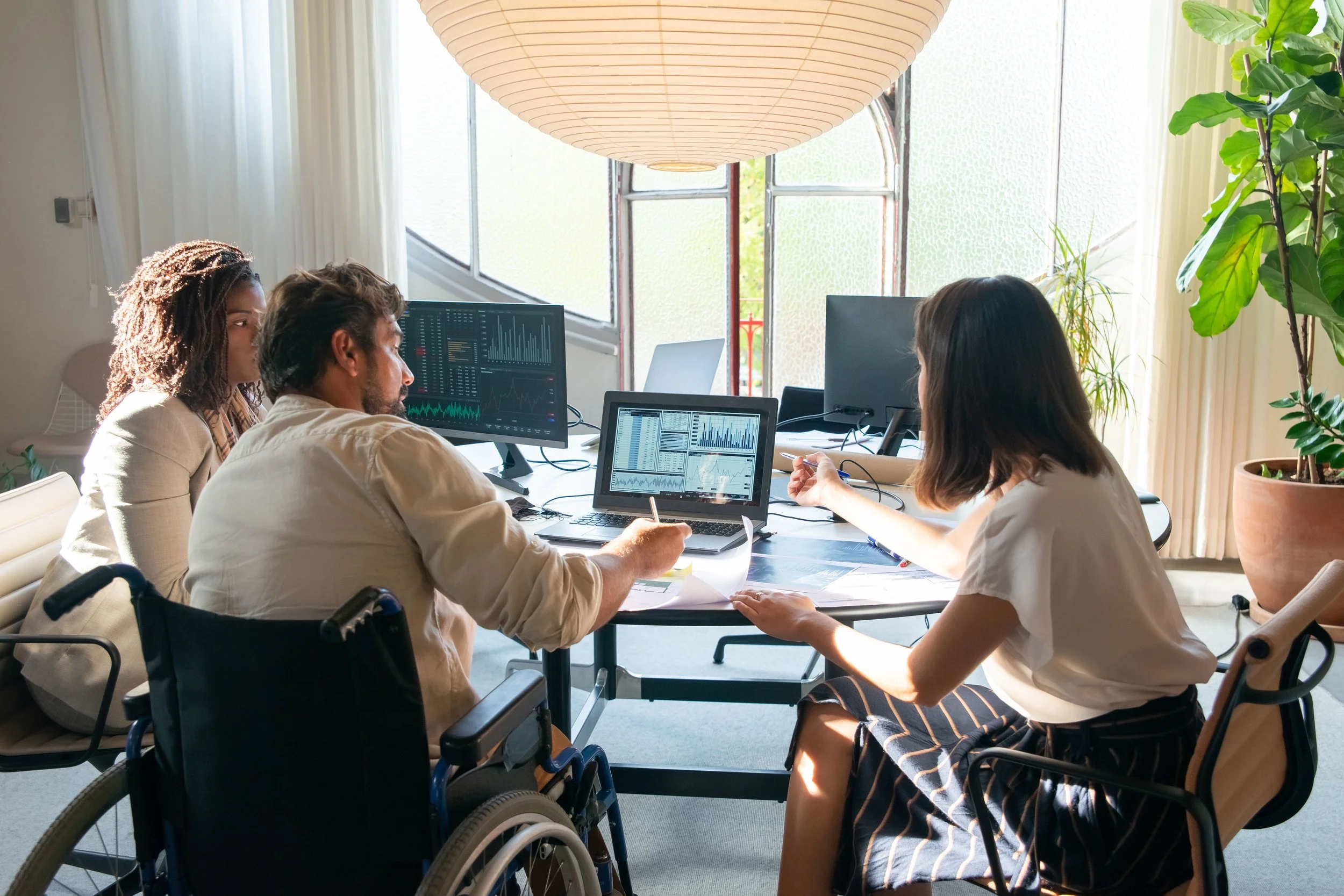 Marketing professionals reviewing charts to measure the incremental impact of advertising