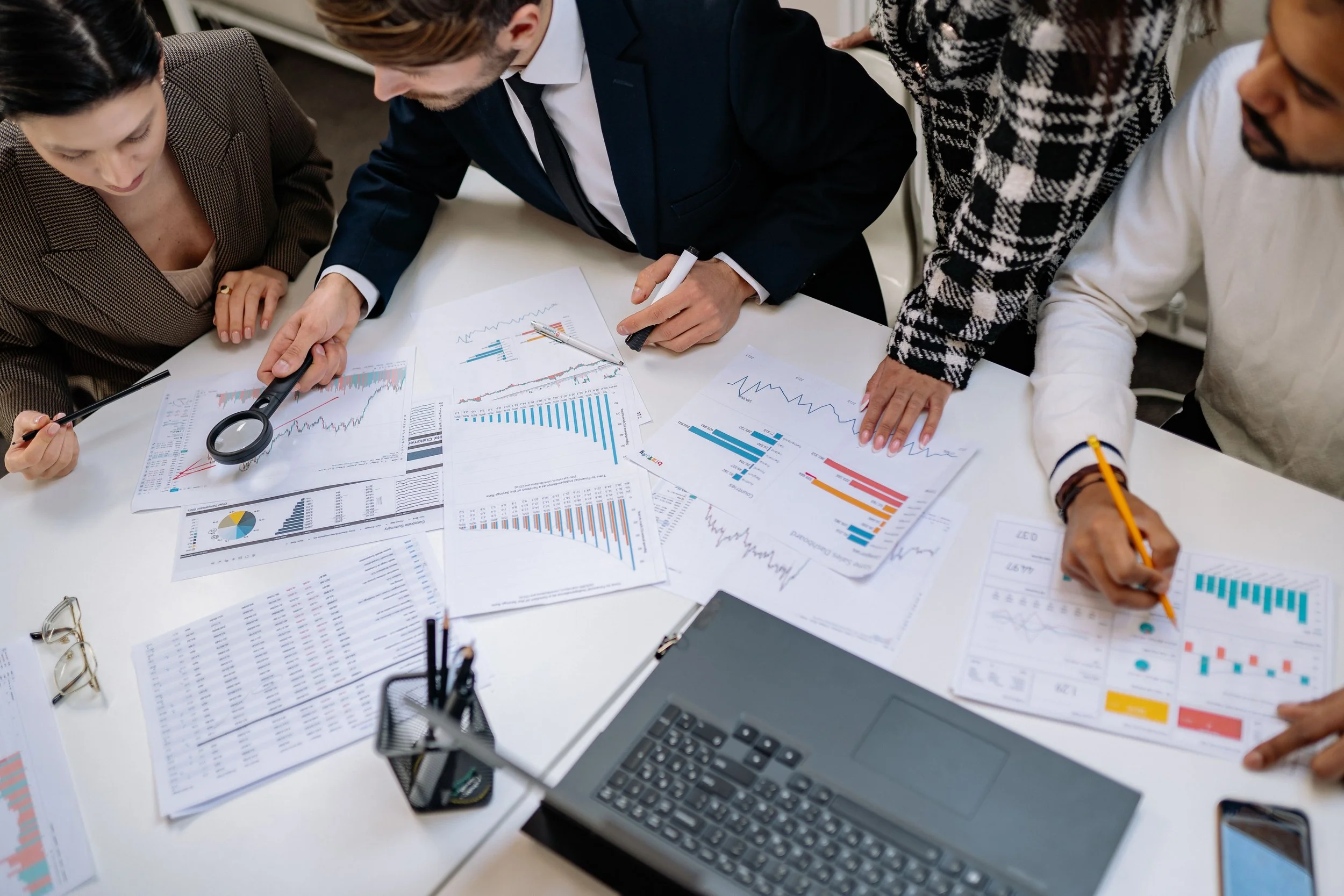 Marketing team analyzing channel performance and budget allocation data