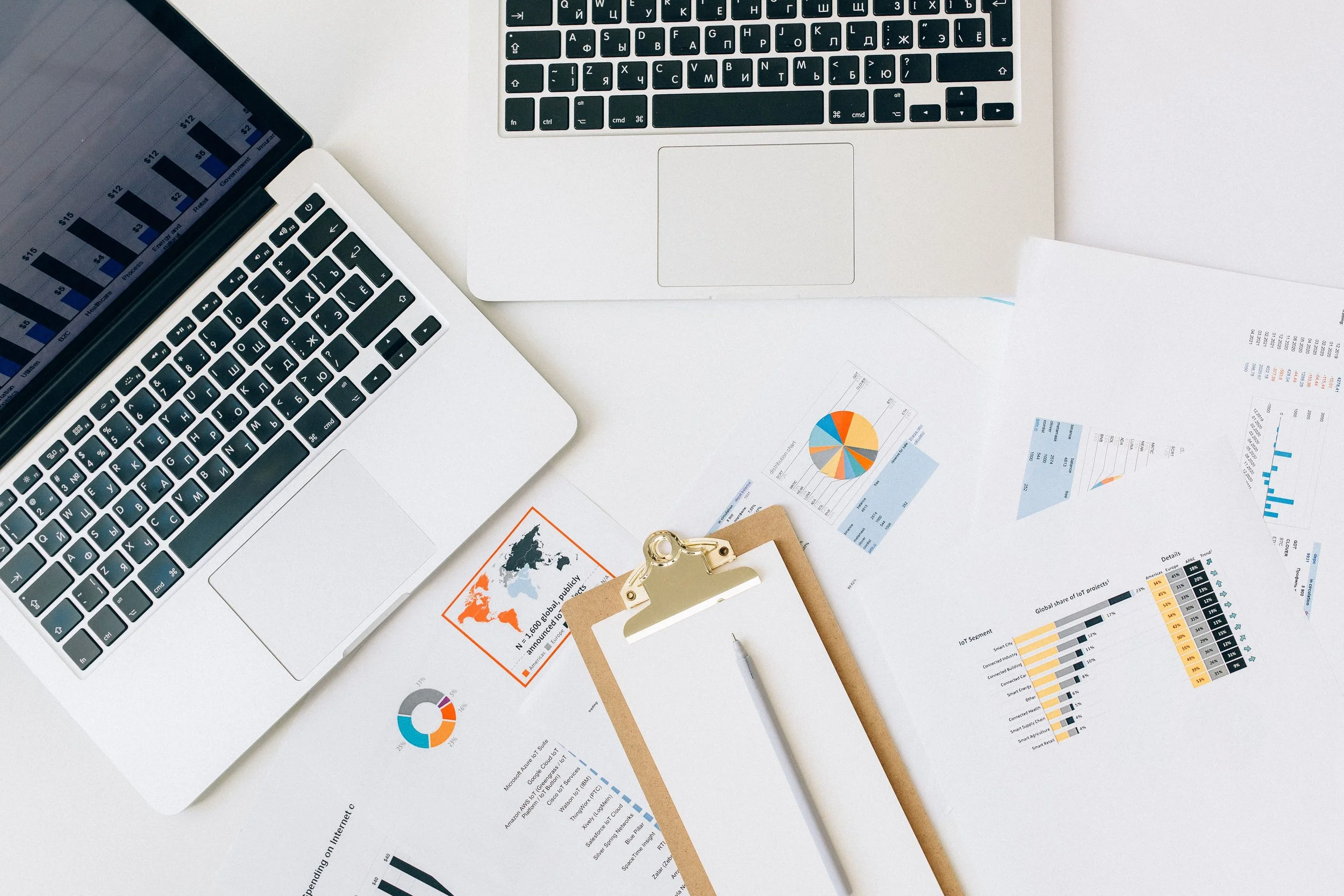 Laptop and business reports being reviewed during an analytics tracking audit