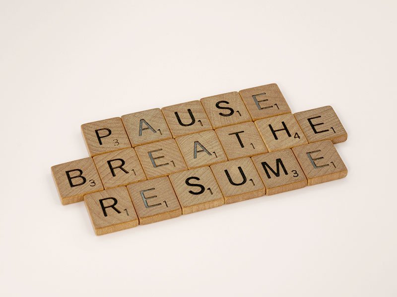 The words Pause breathe and resume made from tiles