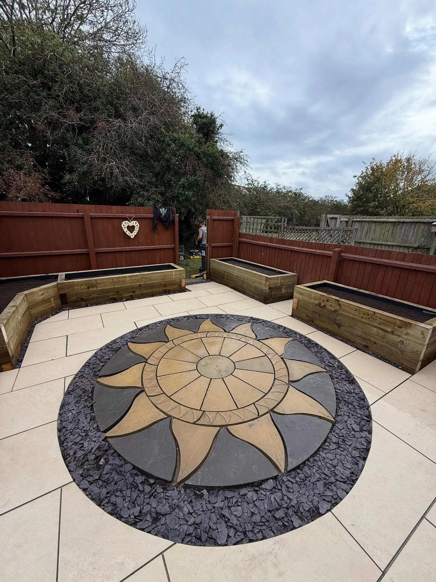 An Impressive 4 day turn around on this garden Transformation 🔥 

Restoring a sentimental patio piece that meant a lot to the client and laying new  beige porcelain tiles has added a great modern feature look. 
Treated sleeper beds built also and re