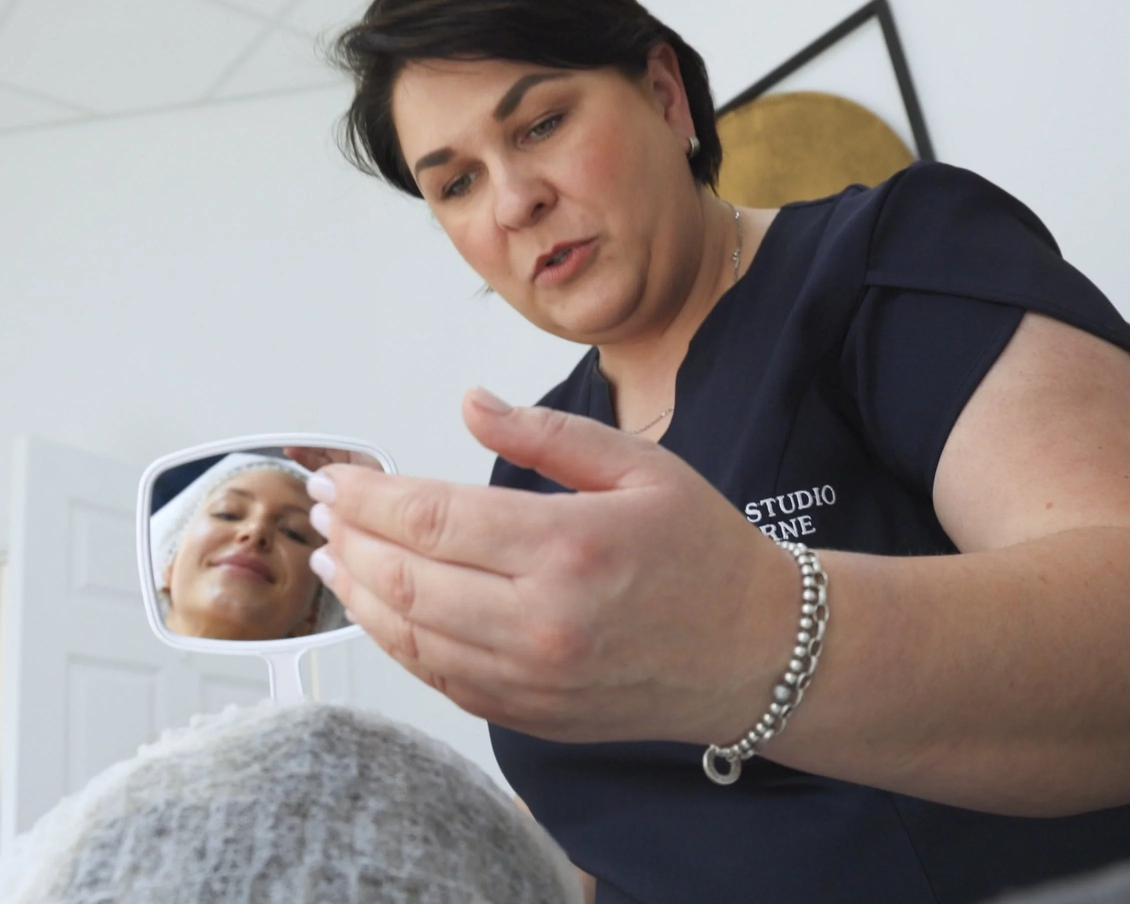 A woman wearing a black uniform with 