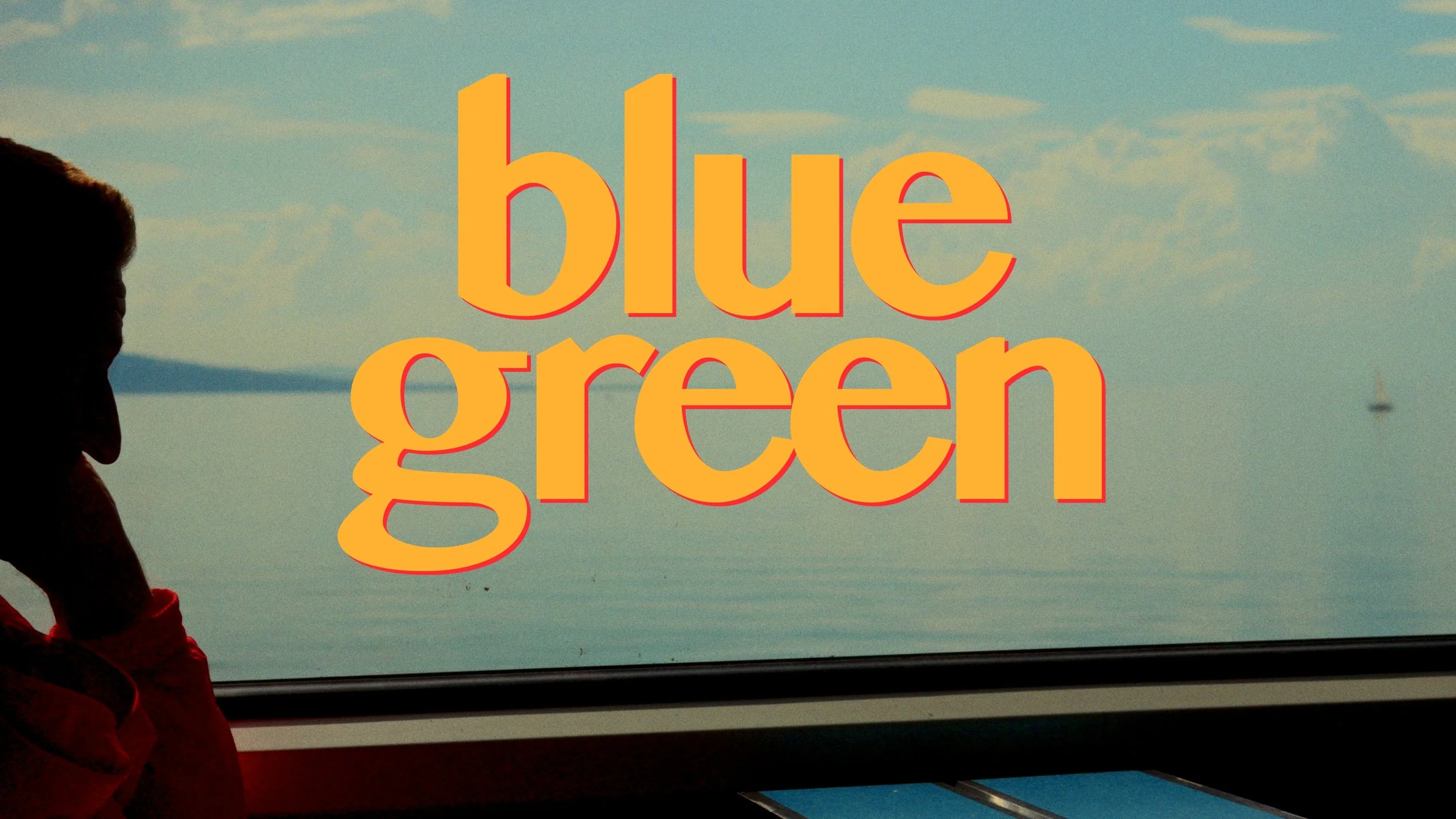 Silhouette of a person on the left side looking out a window at a calm body of water with a sailboat in the distance, overlaid with large, bold text that reads "blue green."
