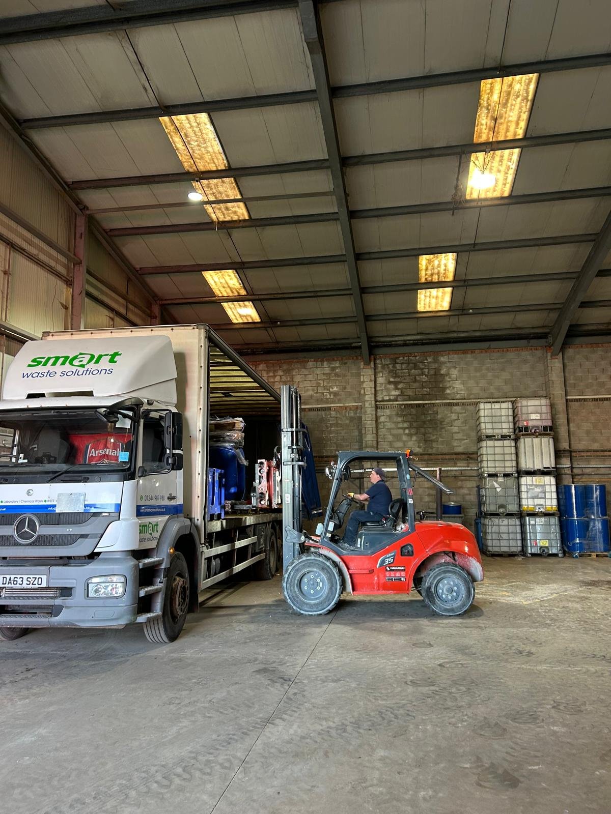 unpacking containers new warehouse.jpg