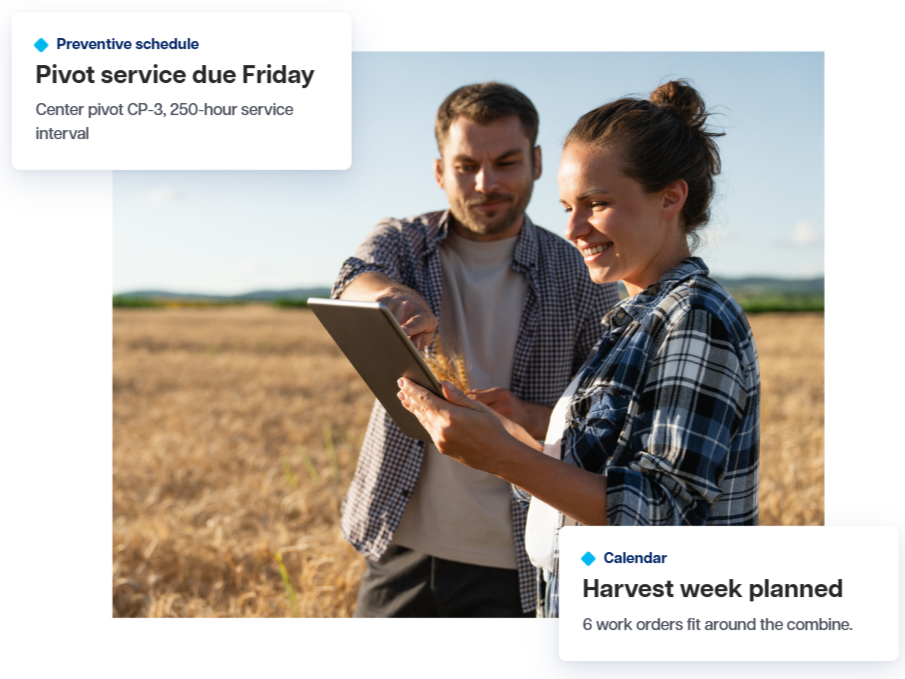 Two farmers look at a tablet together in a wheat field on a sunny day, with two cards for preventive maintenance and harvest scheduling.