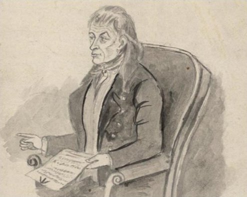 Historical illustration of Iolo Morgannwg seated, holding a document and gesturing with one hand.