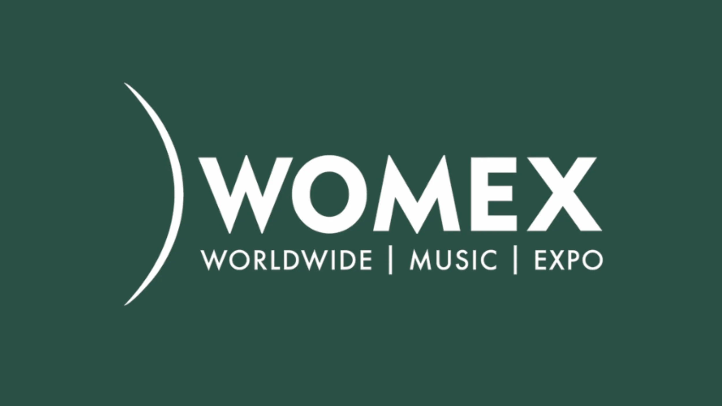 WOMEX logo with text 'WOMEX Worldwide Music Expo' on a dark green background.