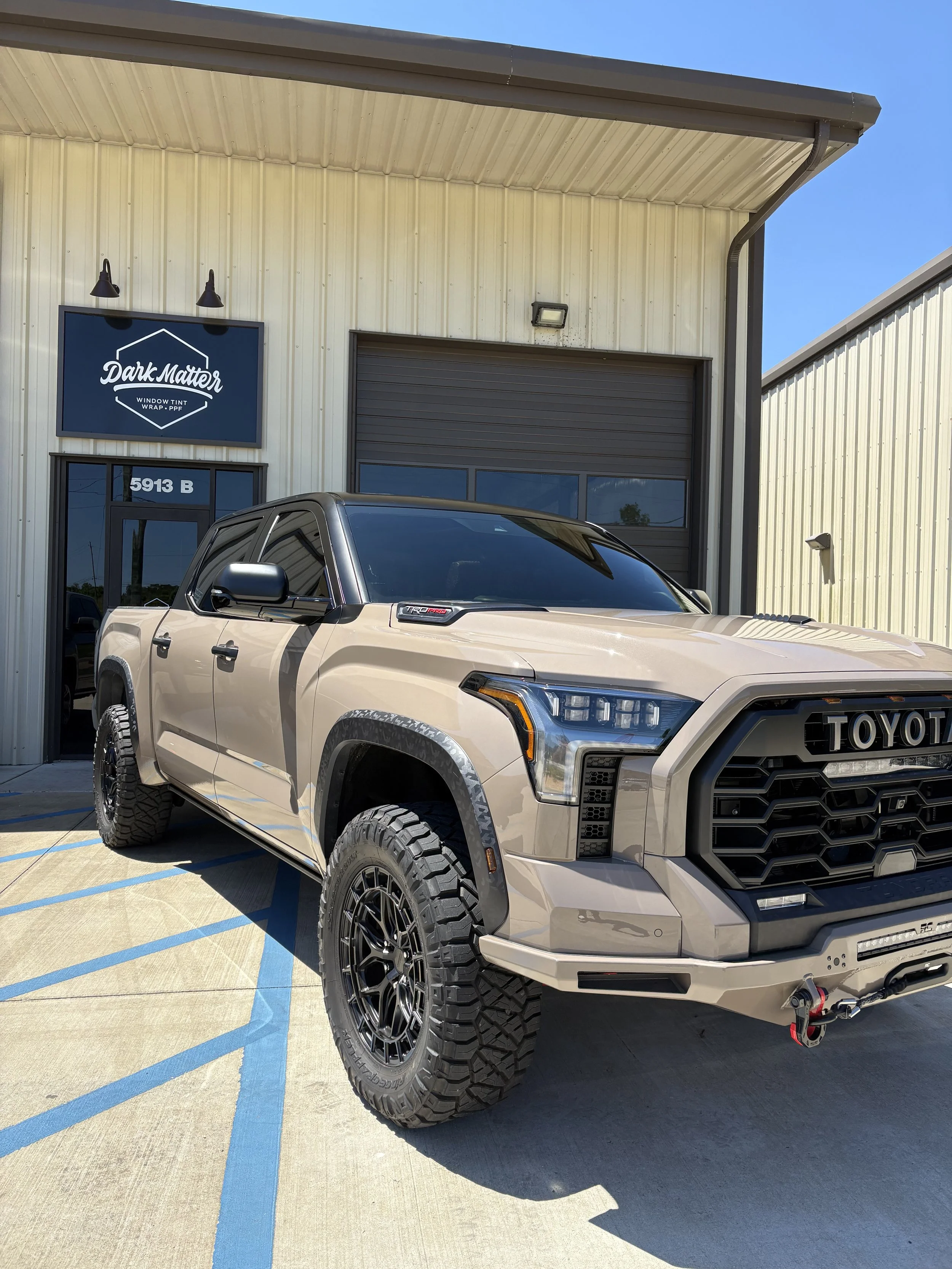 Classic finish vehicle wrap on a GMC Denali, enhancing style and protection with Dark Matter's expert application.