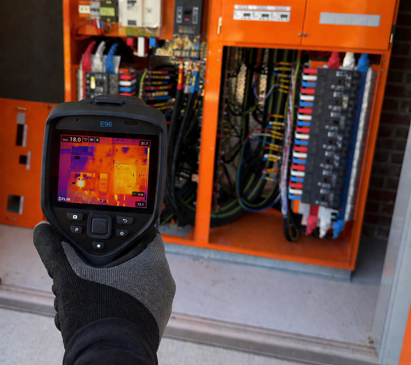 Thermal camera scan in front of commercial switchboard
