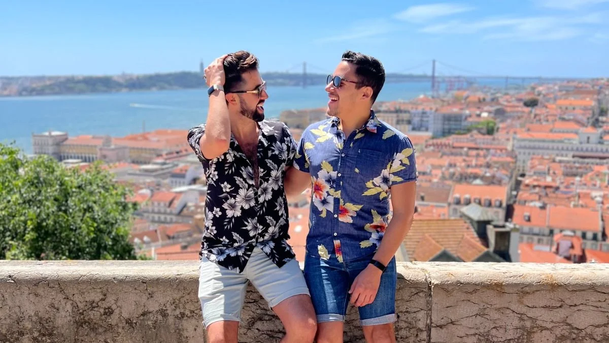 Gay couple walking through Lisbon, Portugal