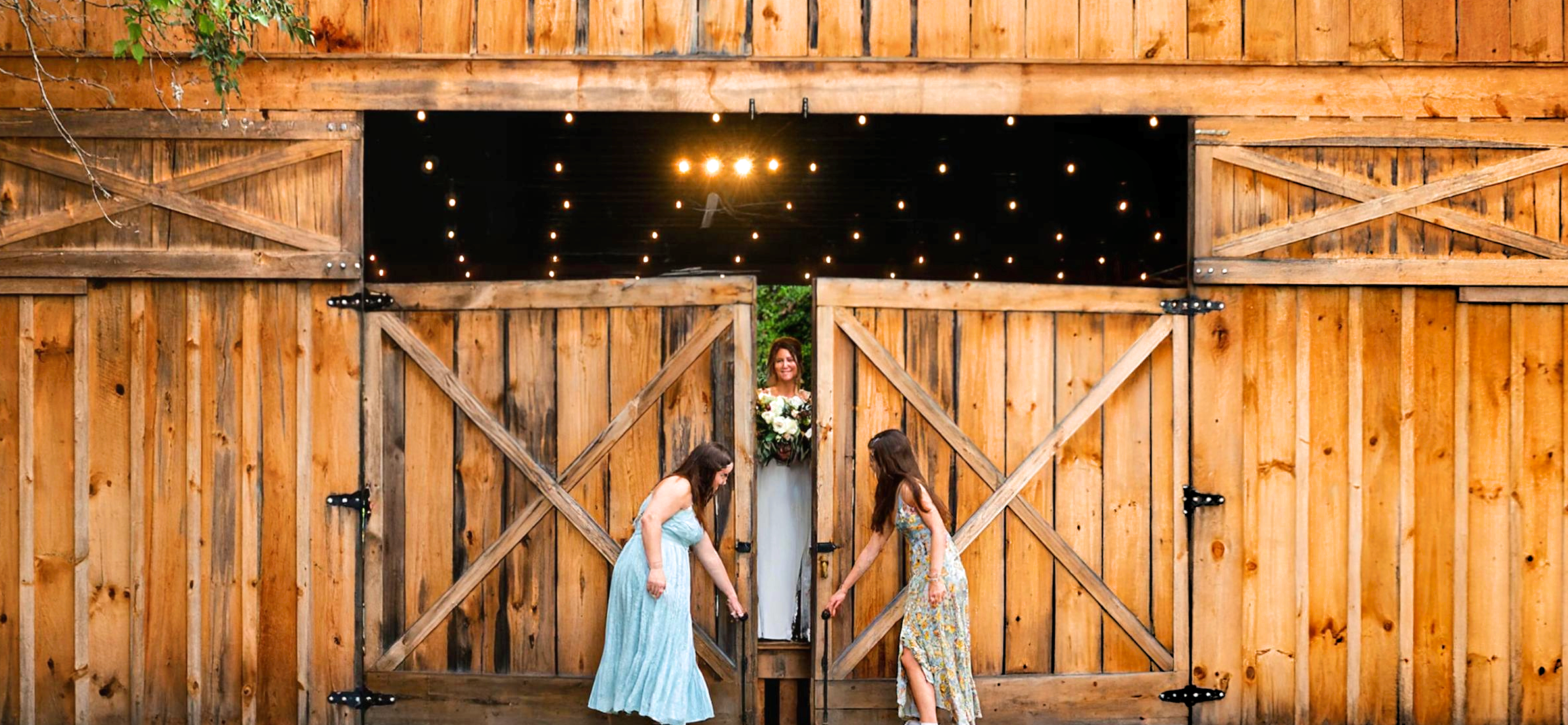 Barn wedding event venue, chandelier, roll up glass doors, string lights, Mountain wedding venue, Asheville Wedding event venue, Brevard Wedding event venue, wedding ceremonies