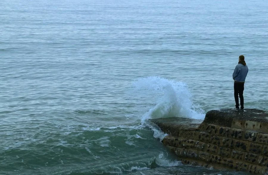 a man standing near water
